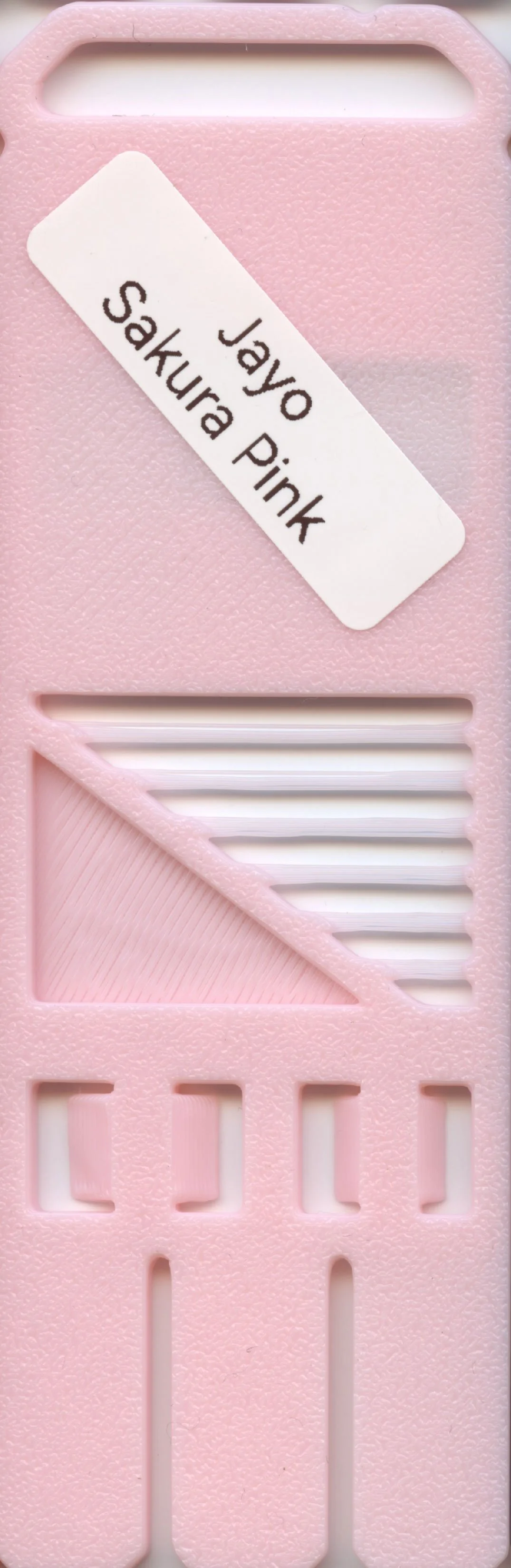 Pink plastic sewing latch with a label reading 'Jayo Sakura Pink'.
