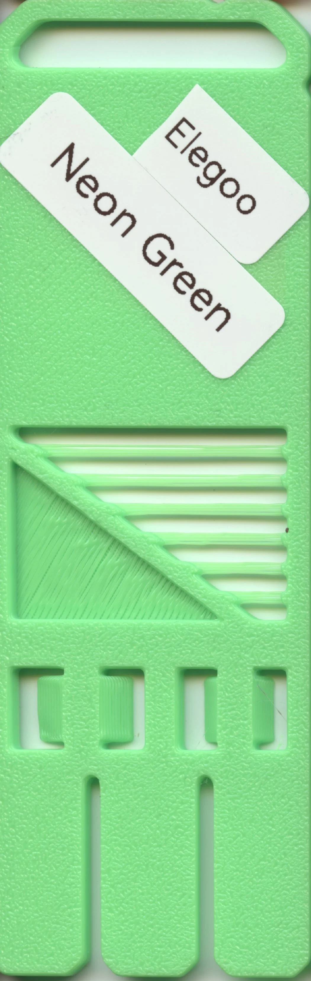 Green plastic card holder with labels reading "Elego" and "Neon Green" attached to it.