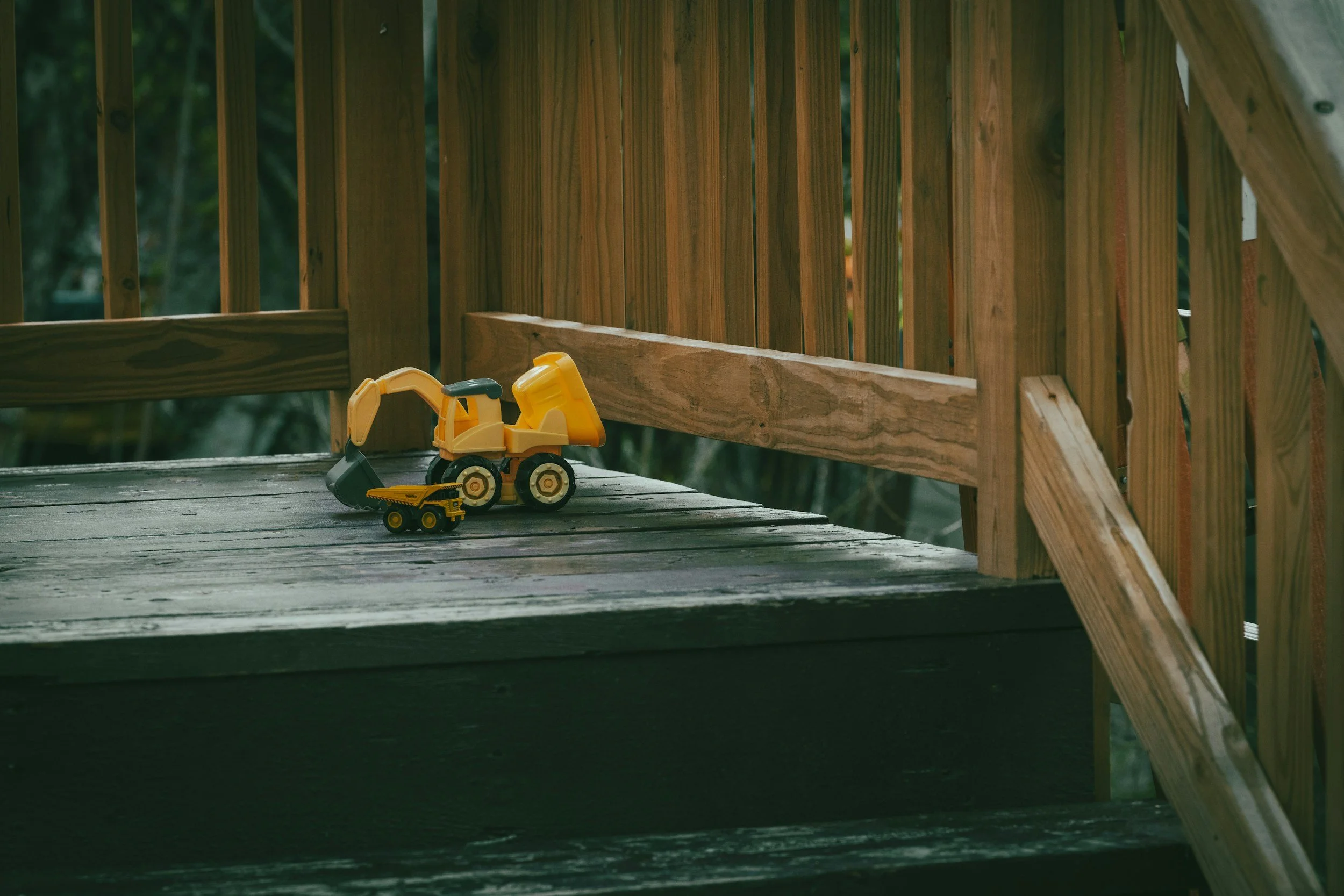 A child’s toy on a deck.