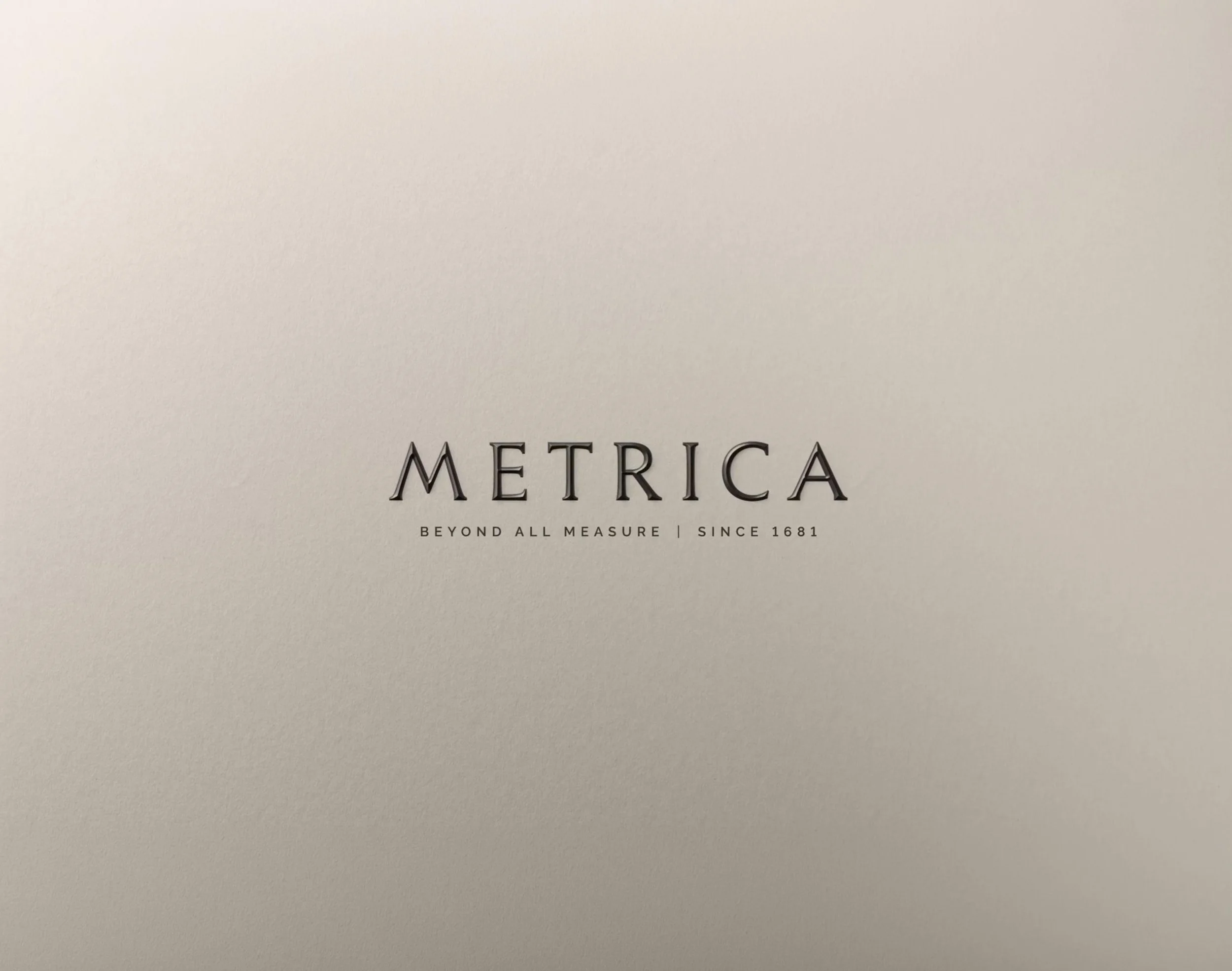 Company name 'METRICA', with the phrase "BEYOND ALL MEASURE" under it