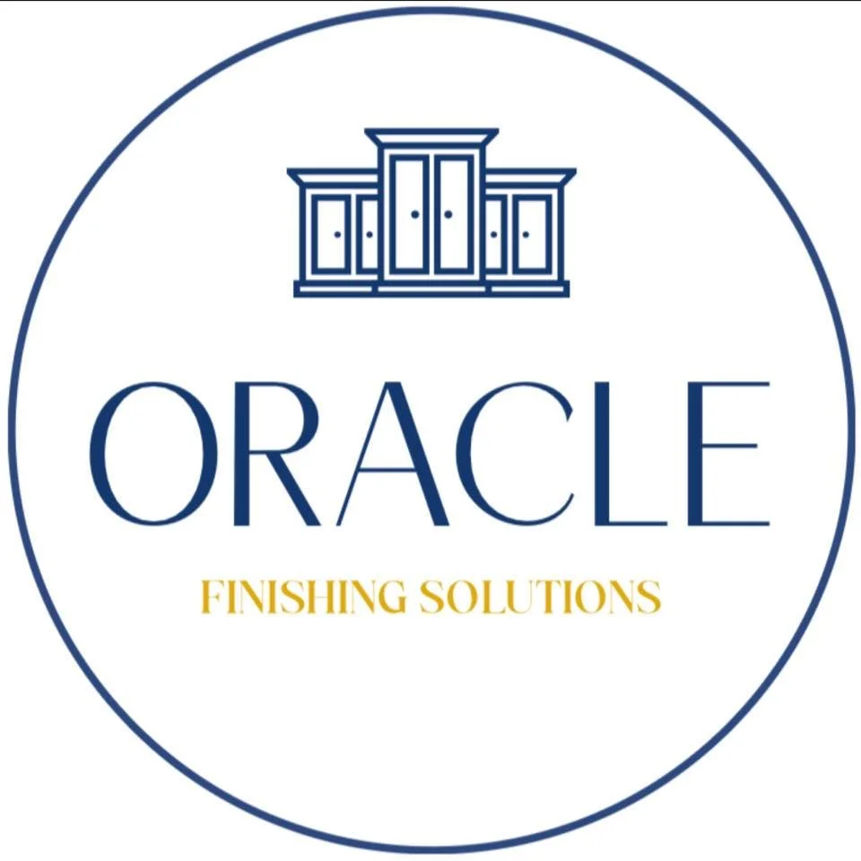 Logo for Oracle Finishing Solutions, featuring a stylized cabinet or furniture piece in blue above the text 'ORACLE' and 'Finishing Solutions' in gold, enclosed in a blue circular border.
