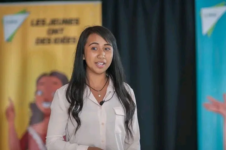 Précieuse Randriamanantsara presenting at a youth leadership event after completing Emzingo's Changemakers Program