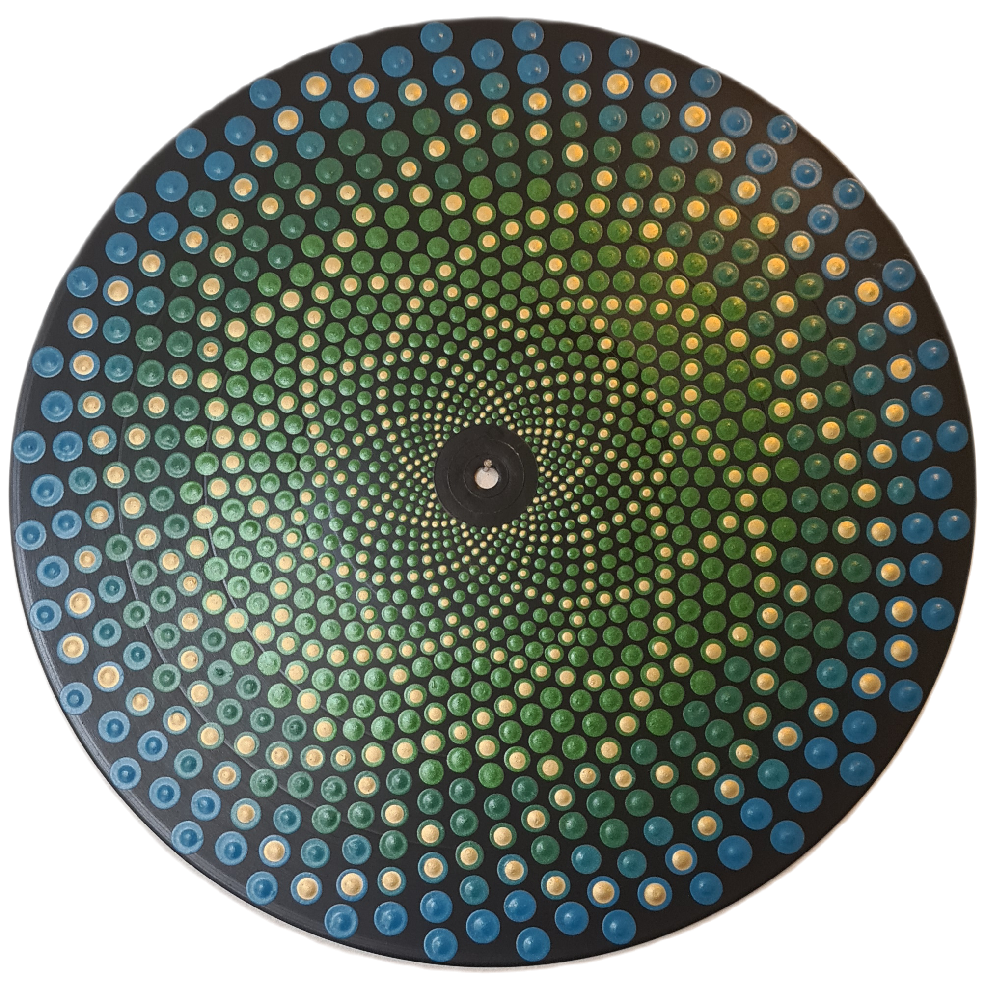 Close-up of a circular object with numerous small, colorful lights arranged in concentric circles, creating a spiral pattern.