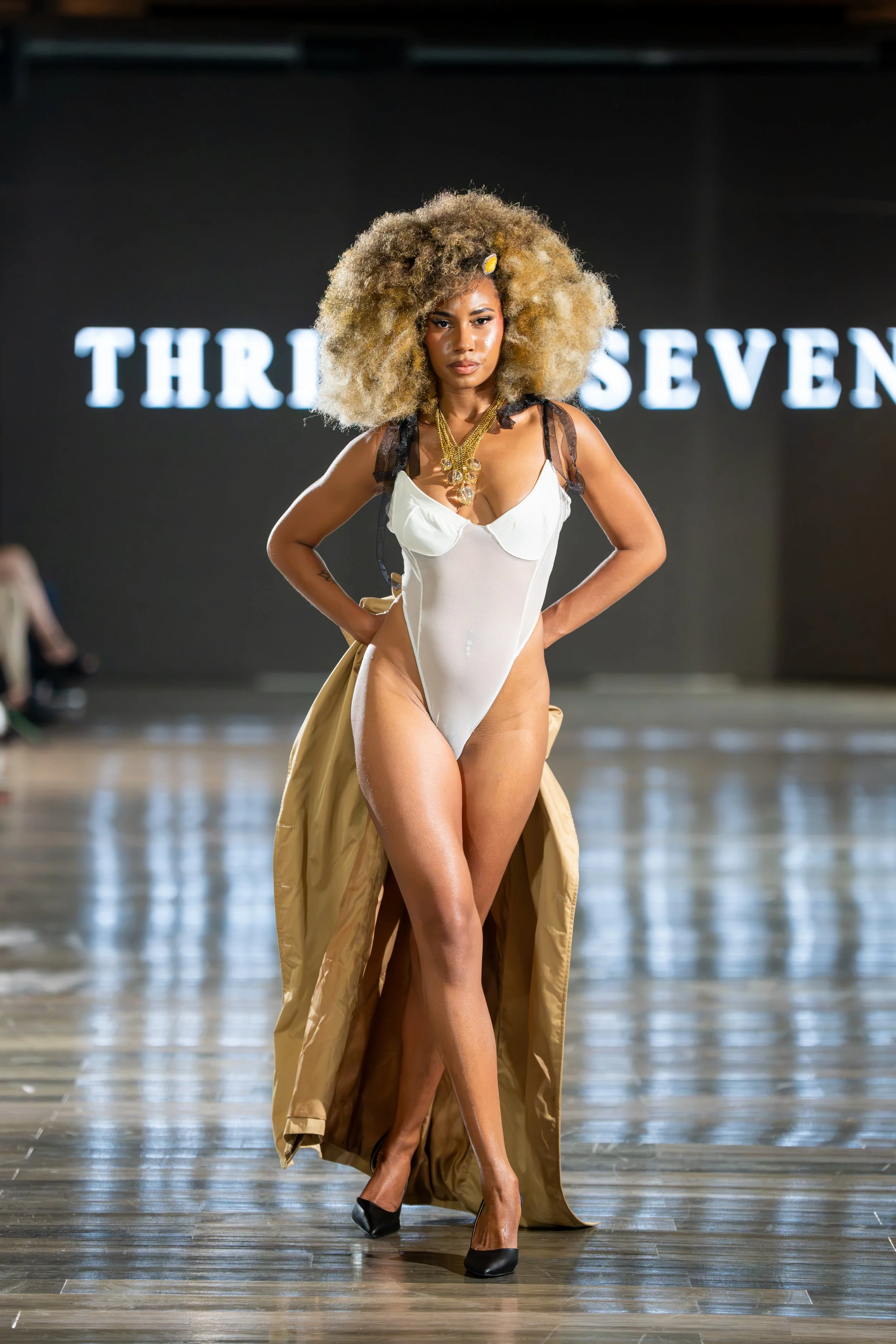 Model walking the runway at Thrilla Seven Fashion Show photographed by Ran With A Cam.
