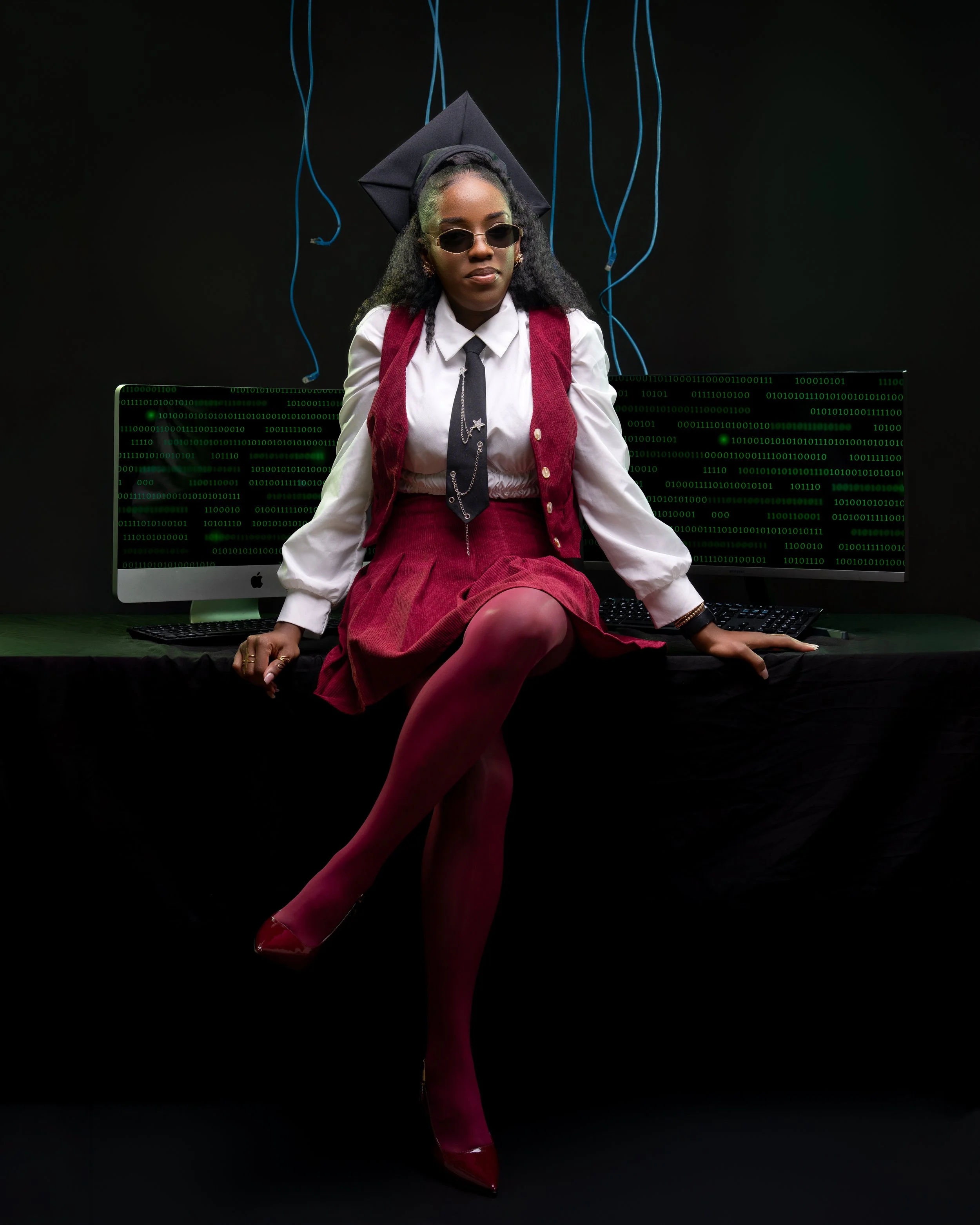 Philadelphia graduation portrait photographer capturing stylish graduate in studio with bold fashion look
