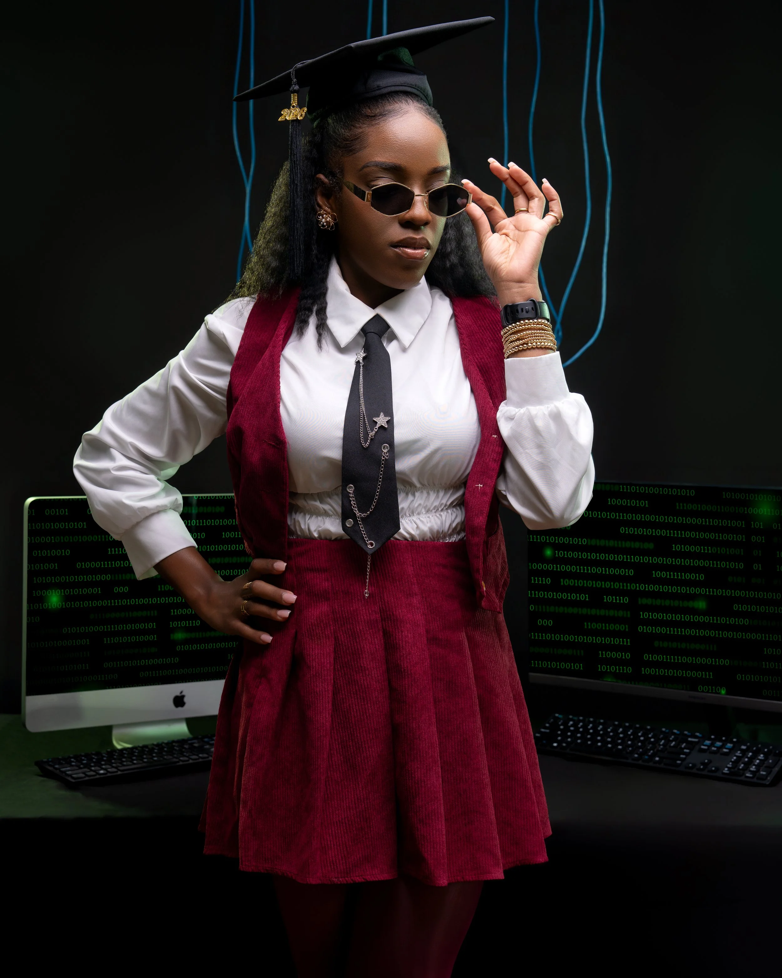 Philadelphia graduation photographer capturing confident grad portrait in studio with modern styling
