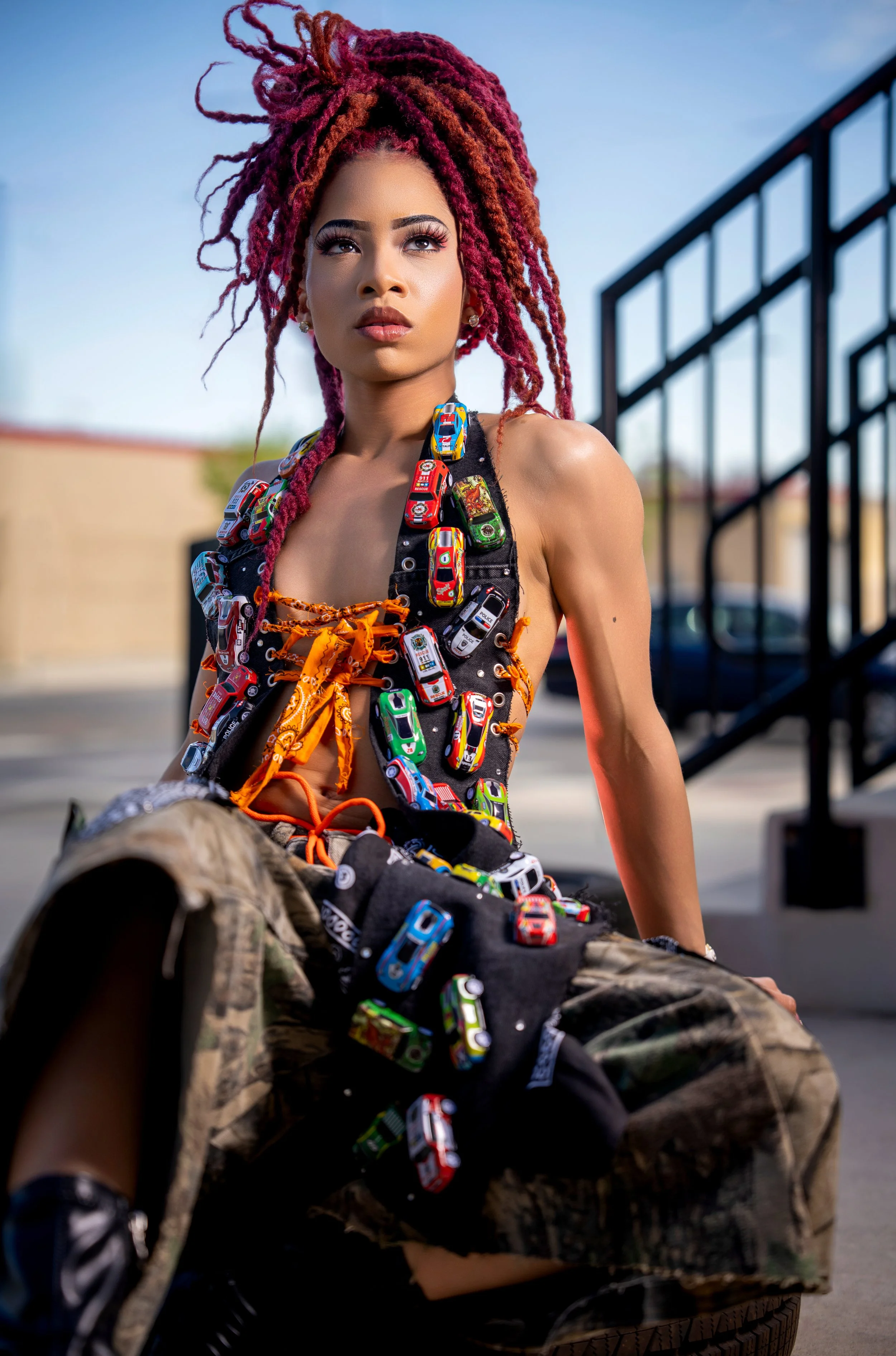 Urban editorial portrait of a fashion model wearing colorful contemporary streetwear.