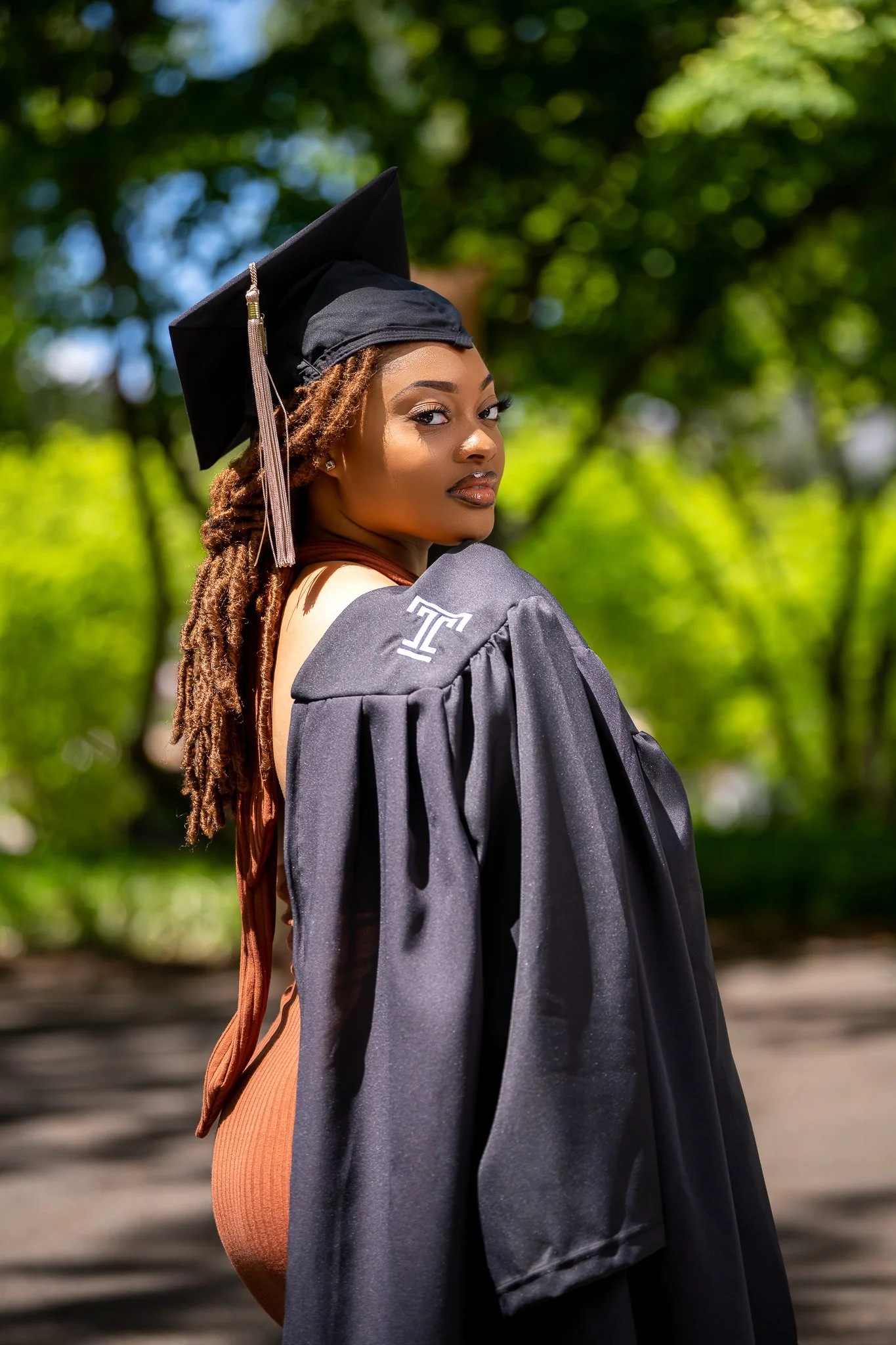 Graduation photoshoot in Philadelphia featuring college graduate by Ran With A Cam photographer