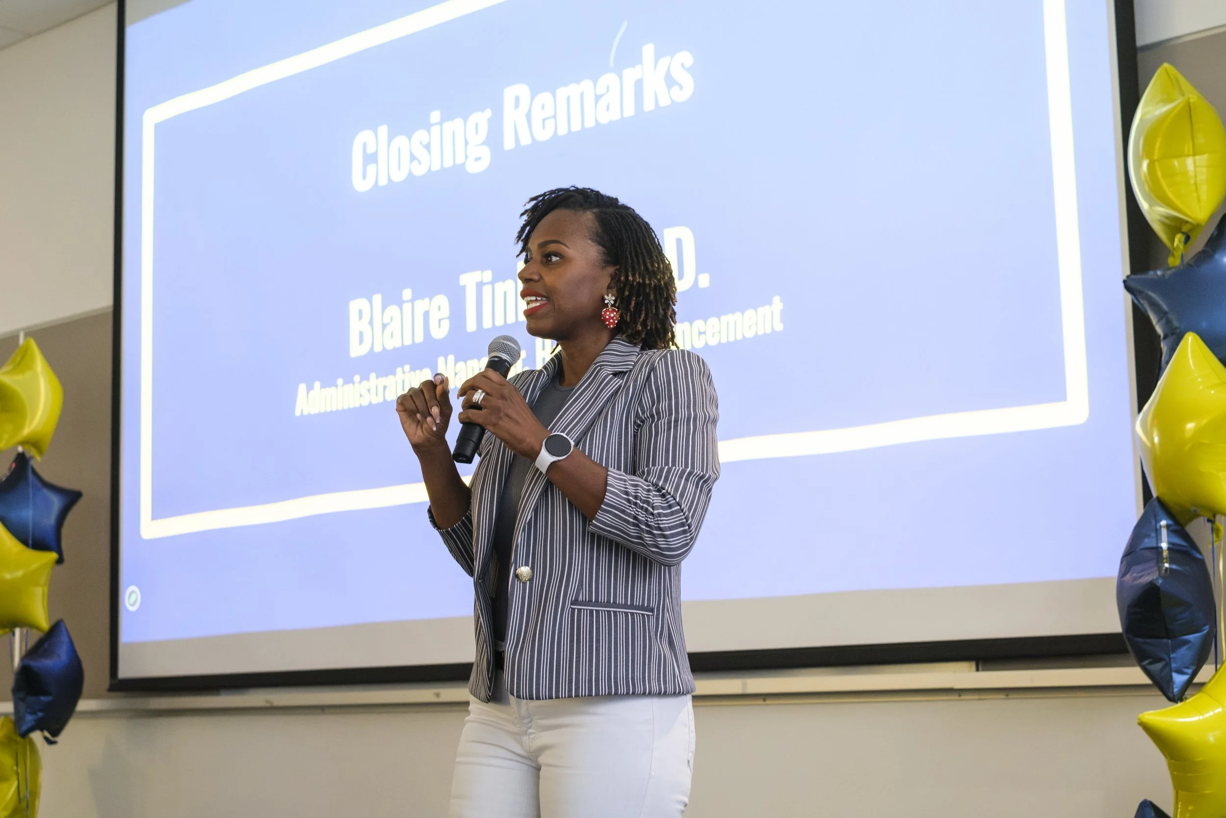 Presenting closing remarks with a microphone