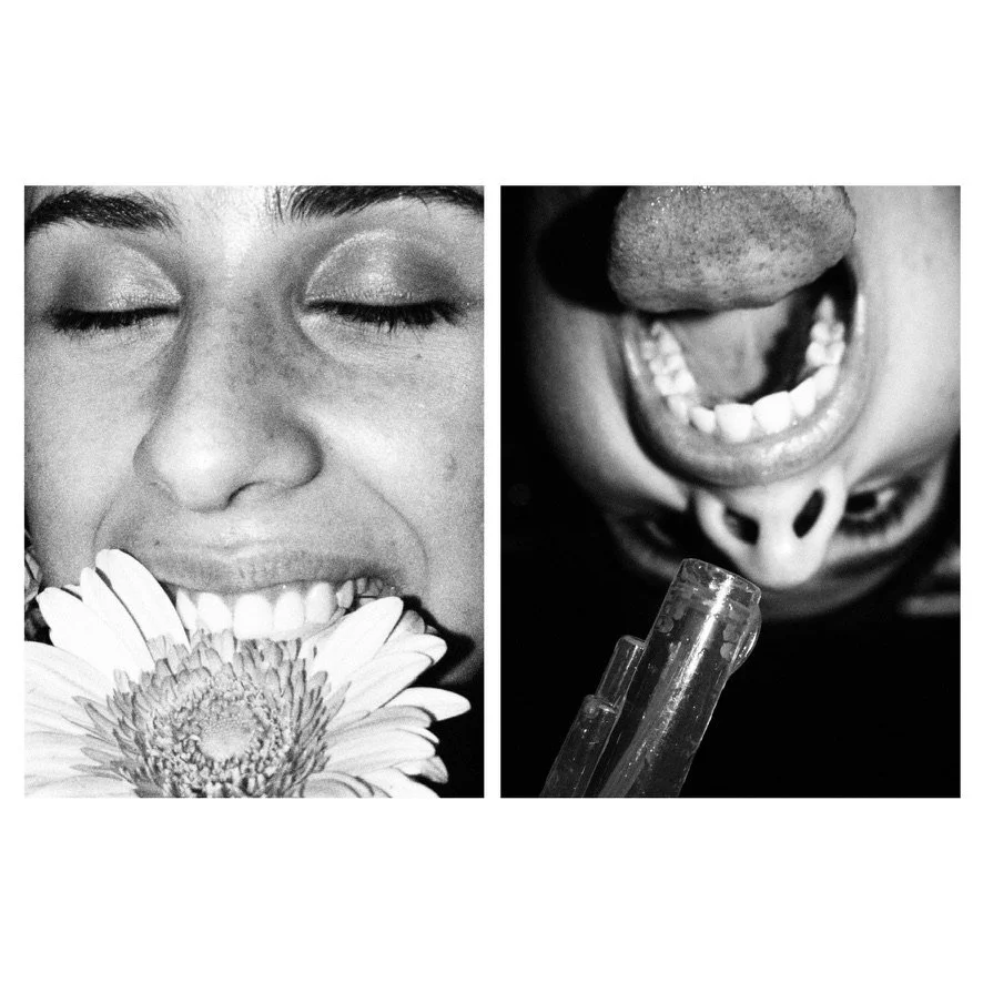 A split-screen black and white photo of a person smiling with their eyes closed and holding a daisy, and an upside-down person with their tongue out, smiling with exposed teeth, and holding a clear object.