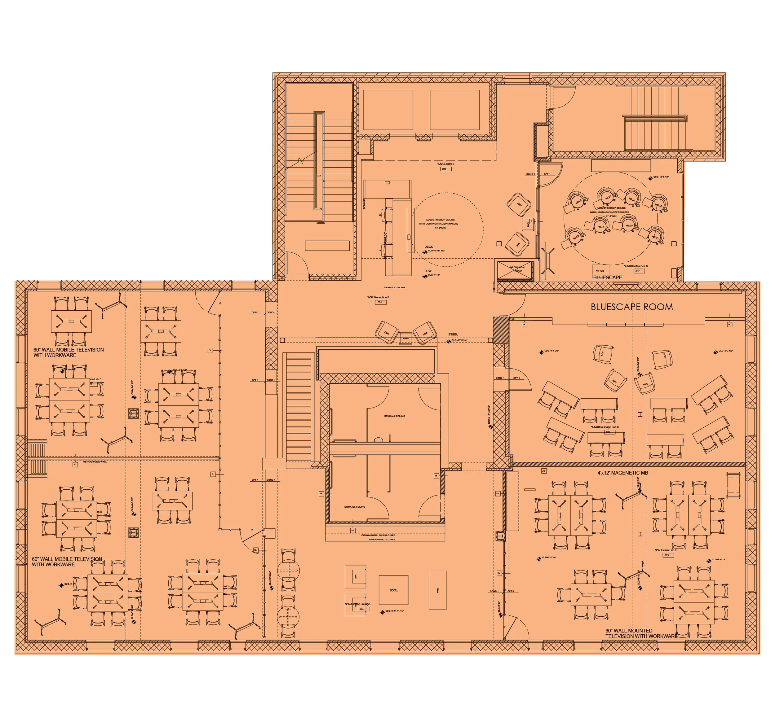 A detailed architectural floor plan with multiple rooms, workspaces, conference areas, and furniture layouts, predominantly in orange.
