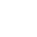 Silhouette of a person sitting at a desk with a computer, surrounded by abstract shapes.