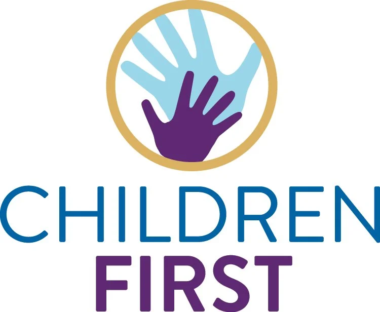 A logo with two handprints, one large and one small, inside a circle, above the text 'Children First' with 'Children' in blue and 'First' in purple.