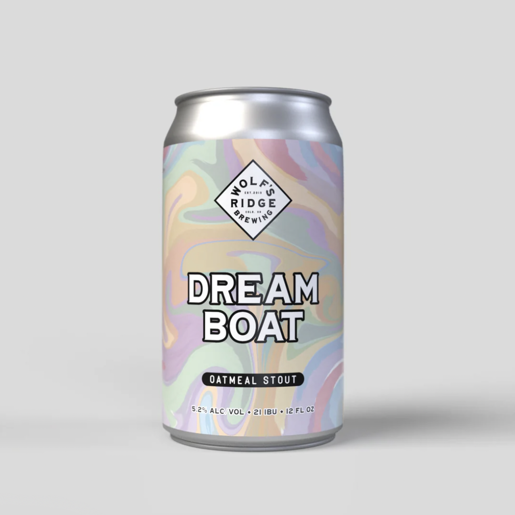 A can of Wolf's Ridge Brewing Dream Boat Oatmeal Stout with colorful, swirling pastel design on the label.