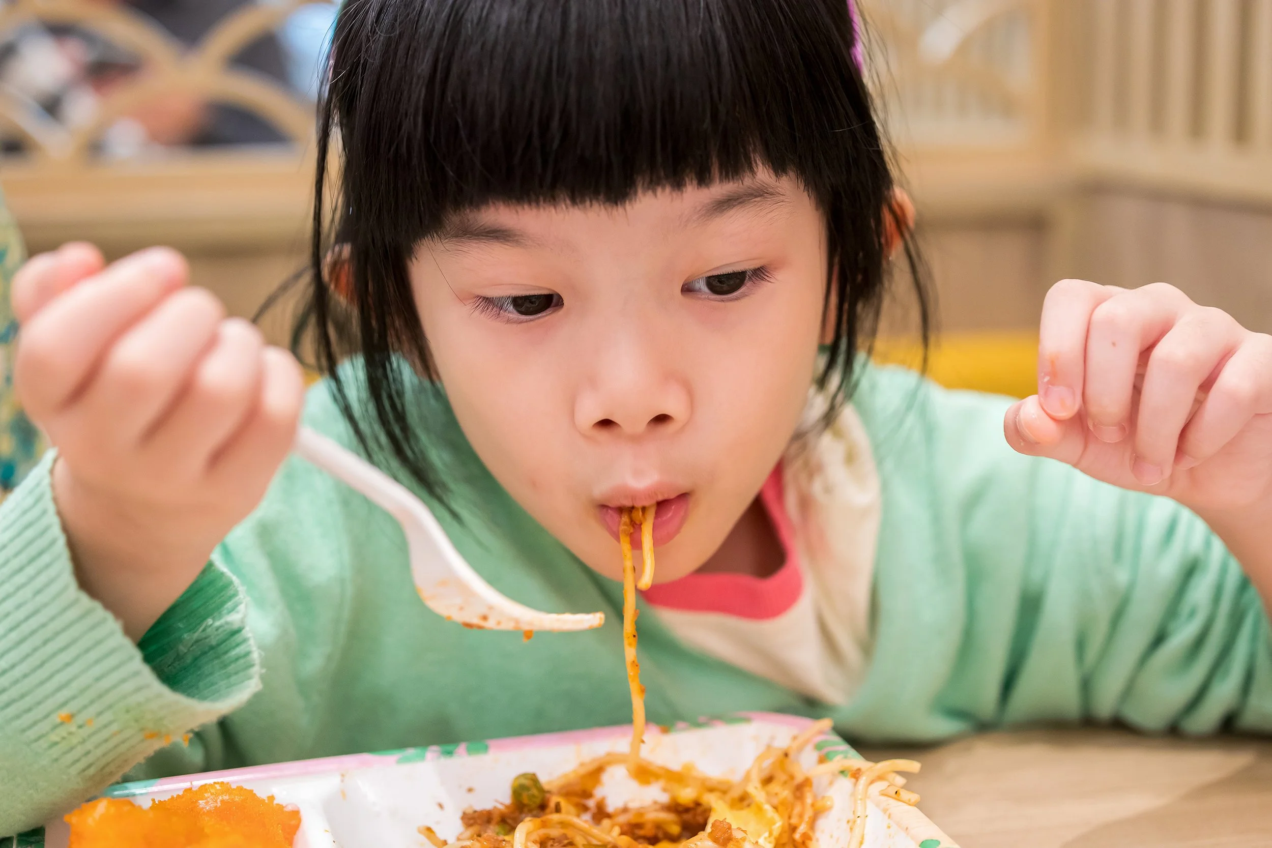 cute-little-asian-child-girl-eating-food.jpg