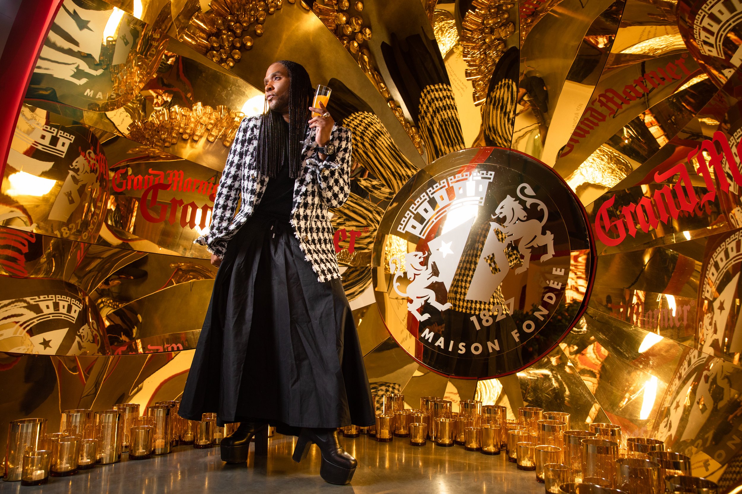 Law Roche at product launch event in front of a Swell designed and fabricated photo moment. 