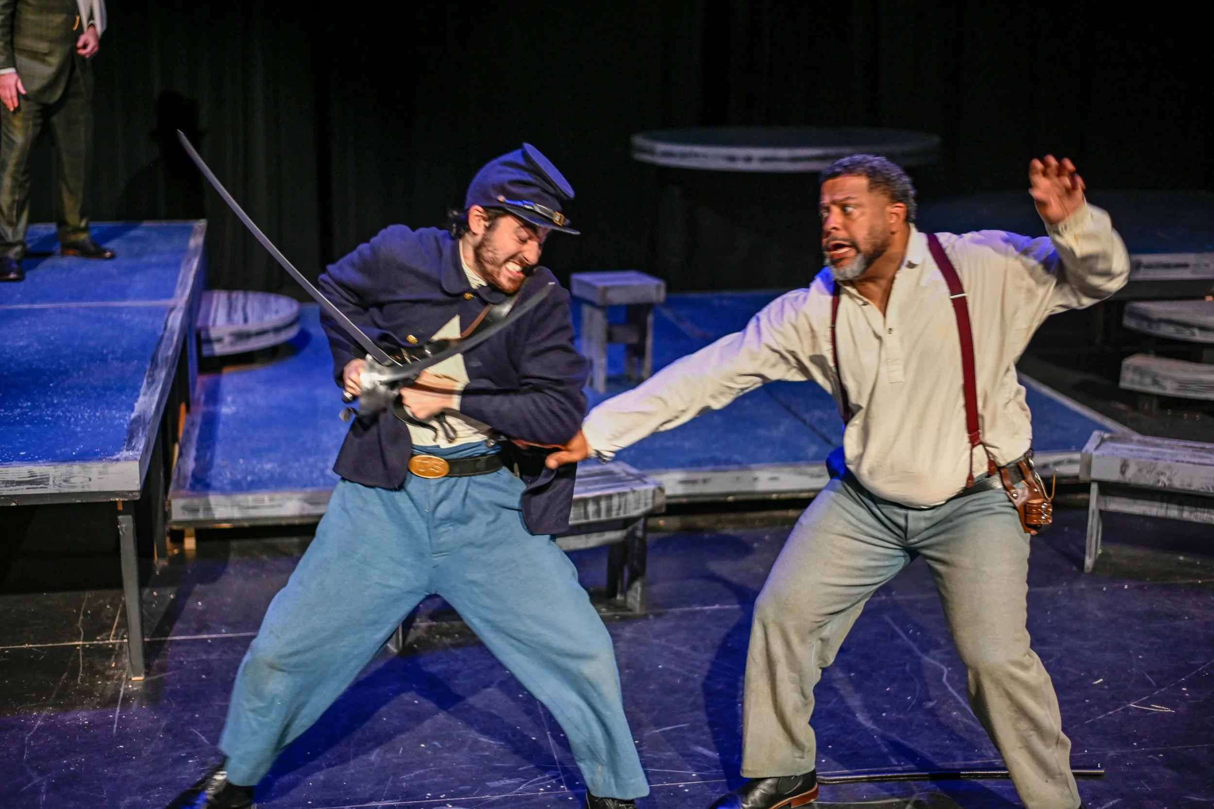 Photograph of Karam Alkatib and David Harris performing a sword fight