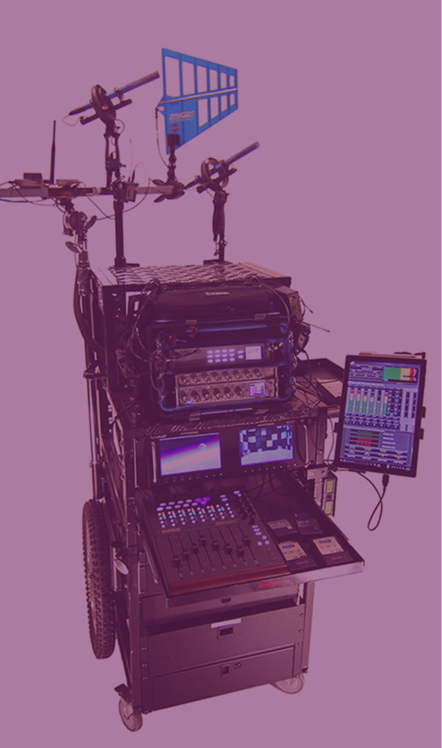 A location sound mixer’s mobile cart equipped with professional Zaxcom gear, featuring multiple monitors, wireless receivers, control surfaces, and antennas for capturing high-quality production sound on set.