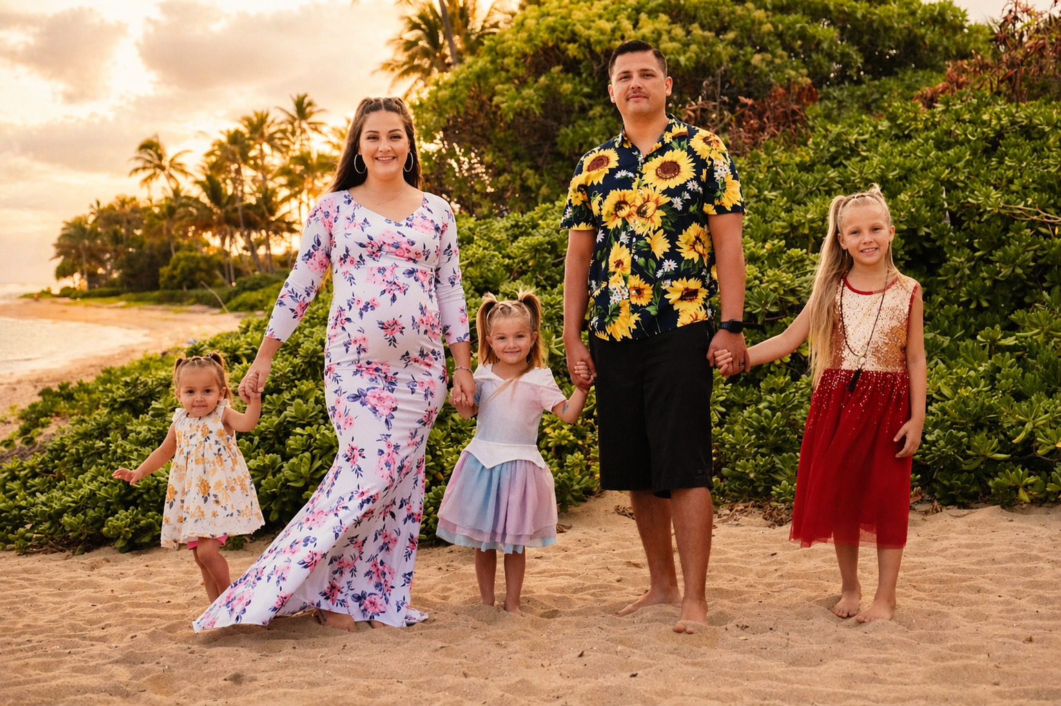 A family of five walking hand-in-hand on a beach during sunset, with lush green foliage and palm trees in the background. The adults are a man and woman in tropical attire, and the children are three young girls wearing colorful dresses.