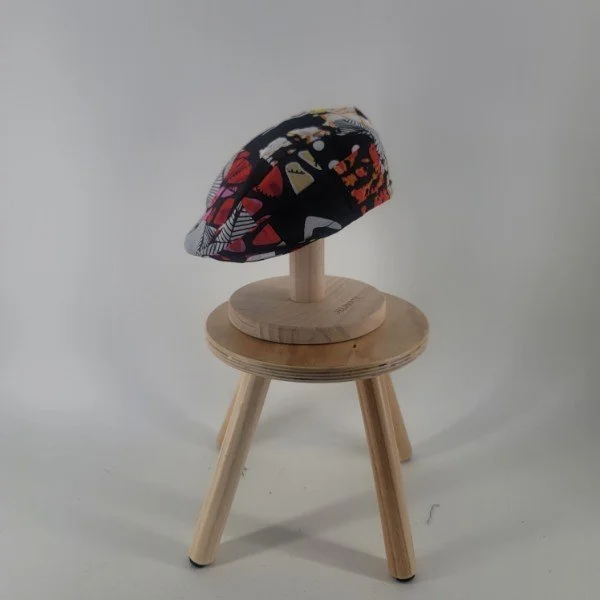 flat cap in pops of red.jpeg