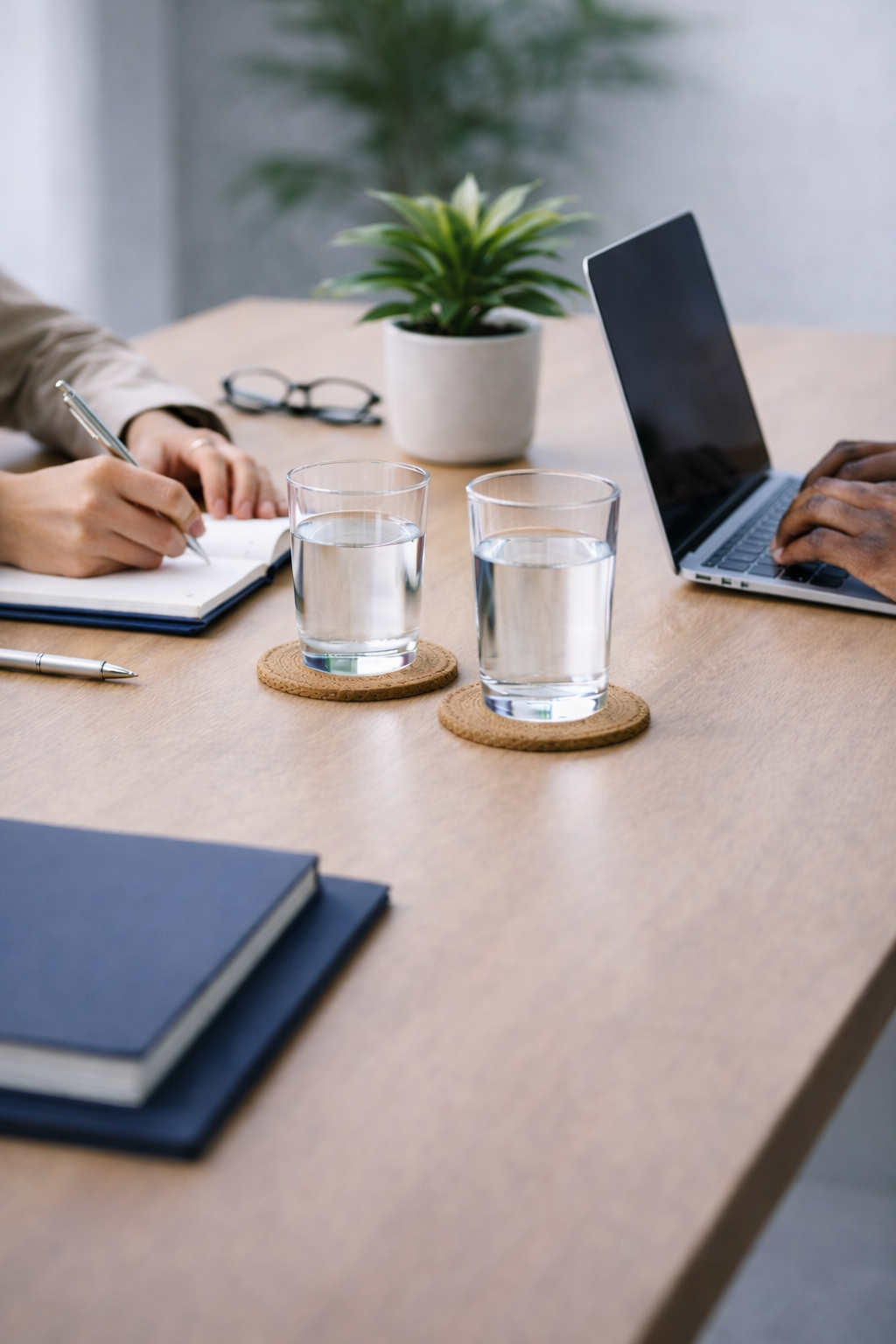 B2B professionals collaborating at a conference table during a strategic media and analyst relations planning meeting.