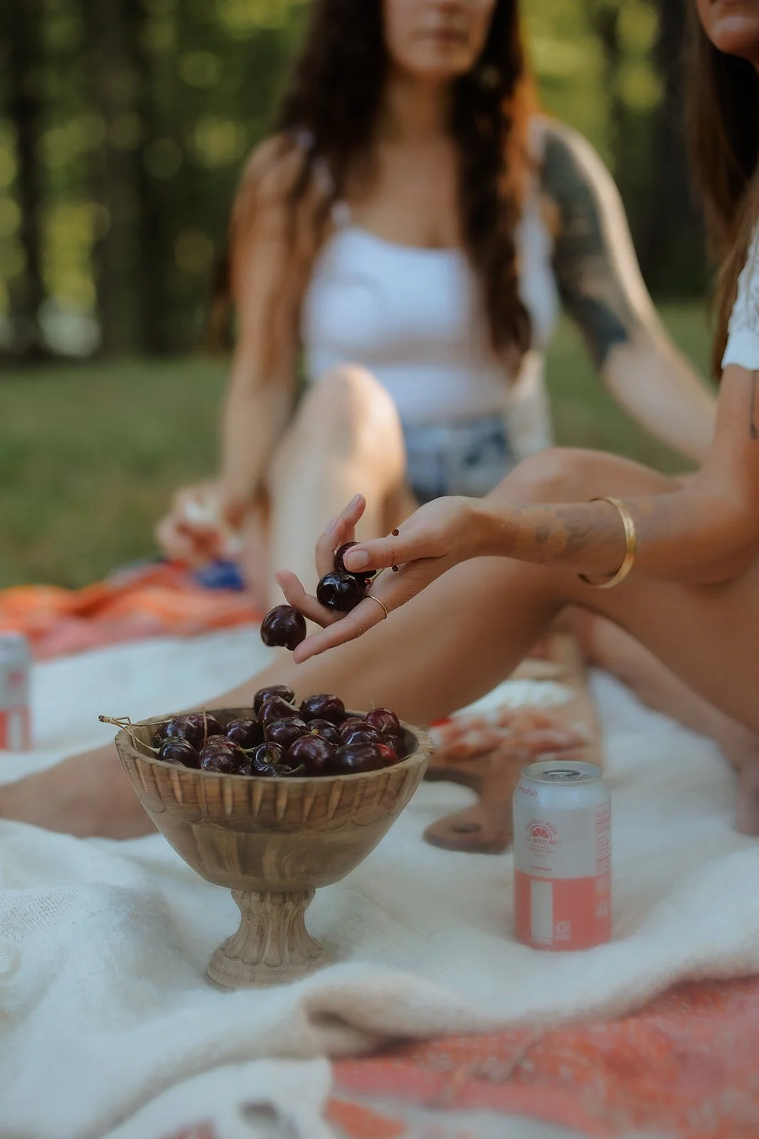 Editorial branding portrait of female entrepreneur rolling cherries down her finger