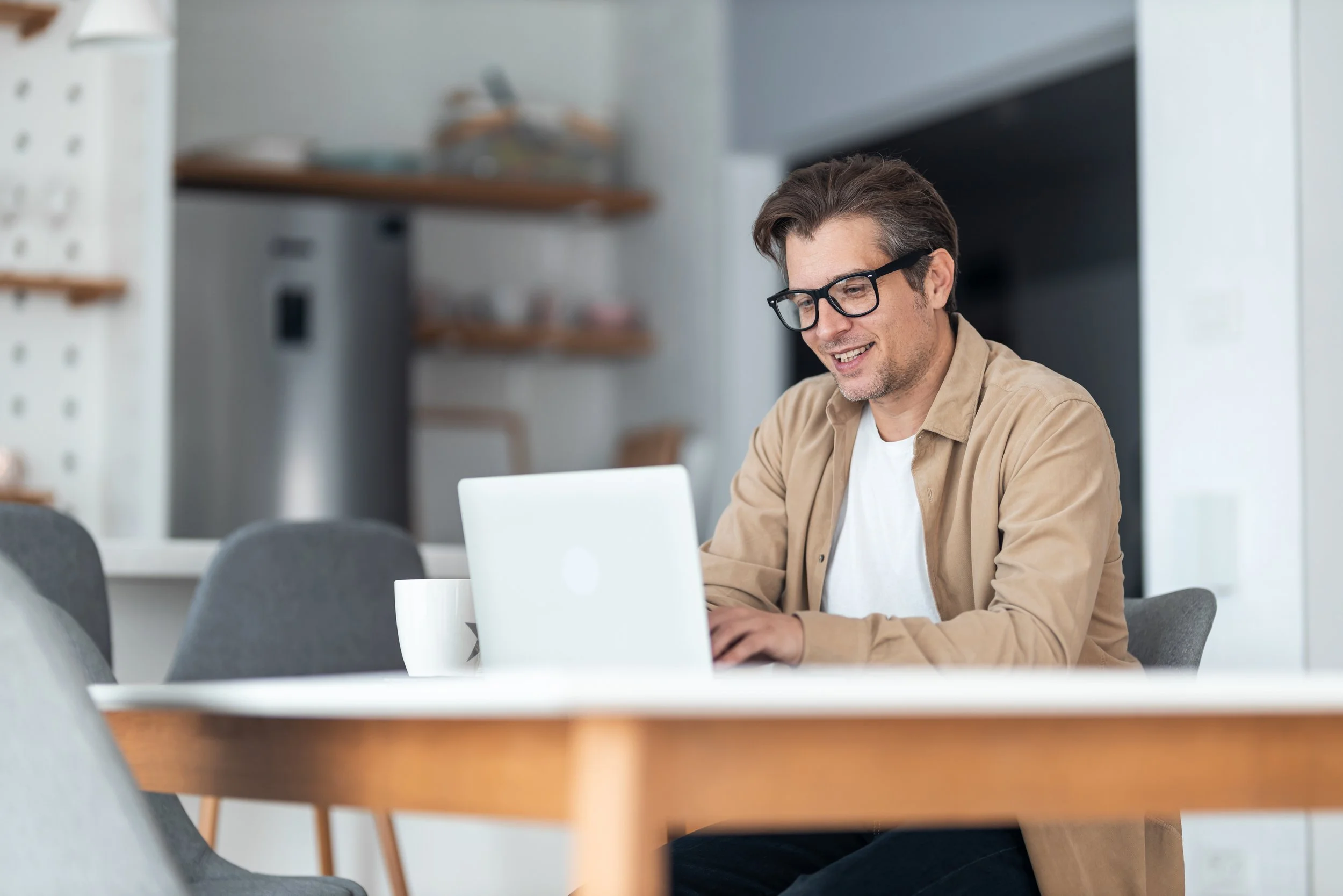 Laptop showing an SEO-optimized blog post with search keywords and traffic growth