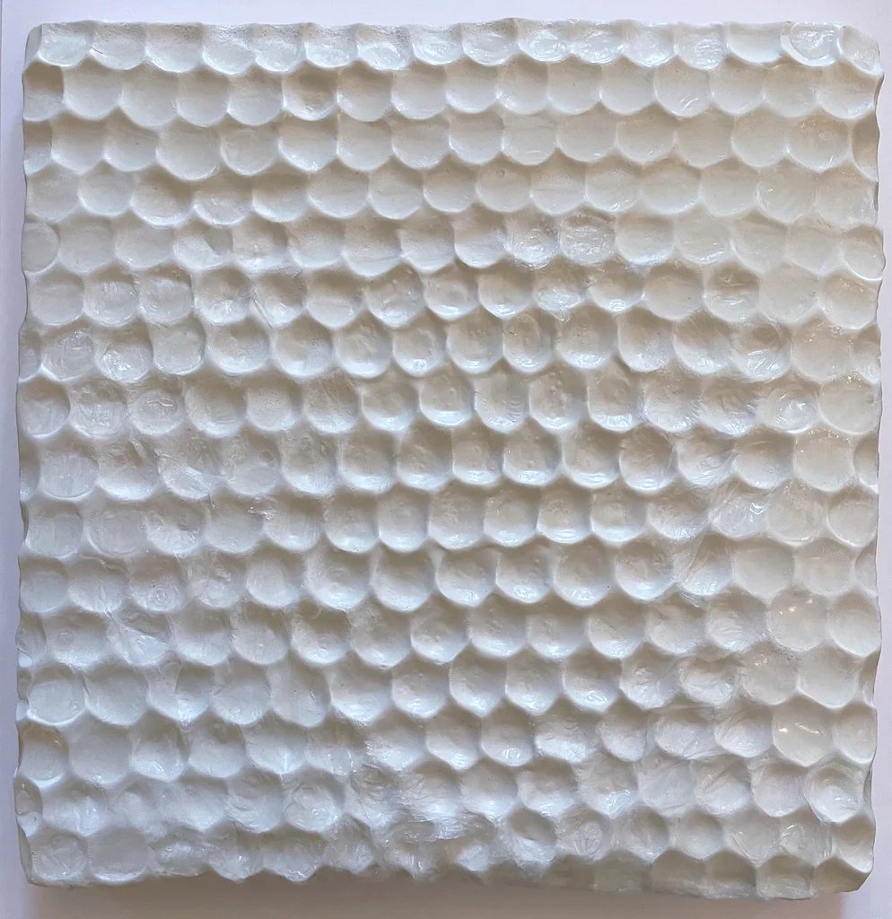 Soap Cells, 2025. Poly clay and glycerin soap on woodboard.