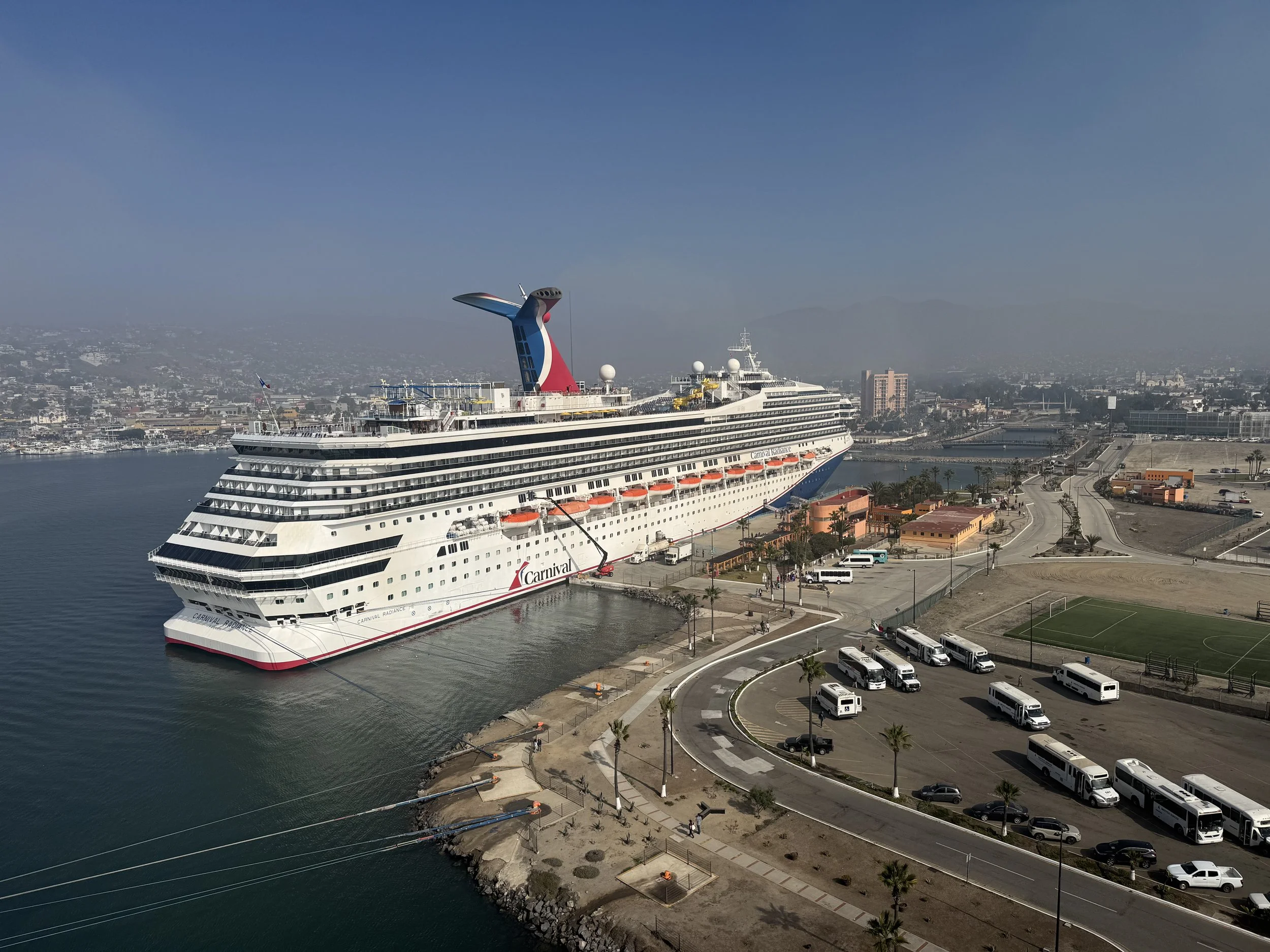 Carnival cruise ship docked at port for a seven-night cruise itinerary