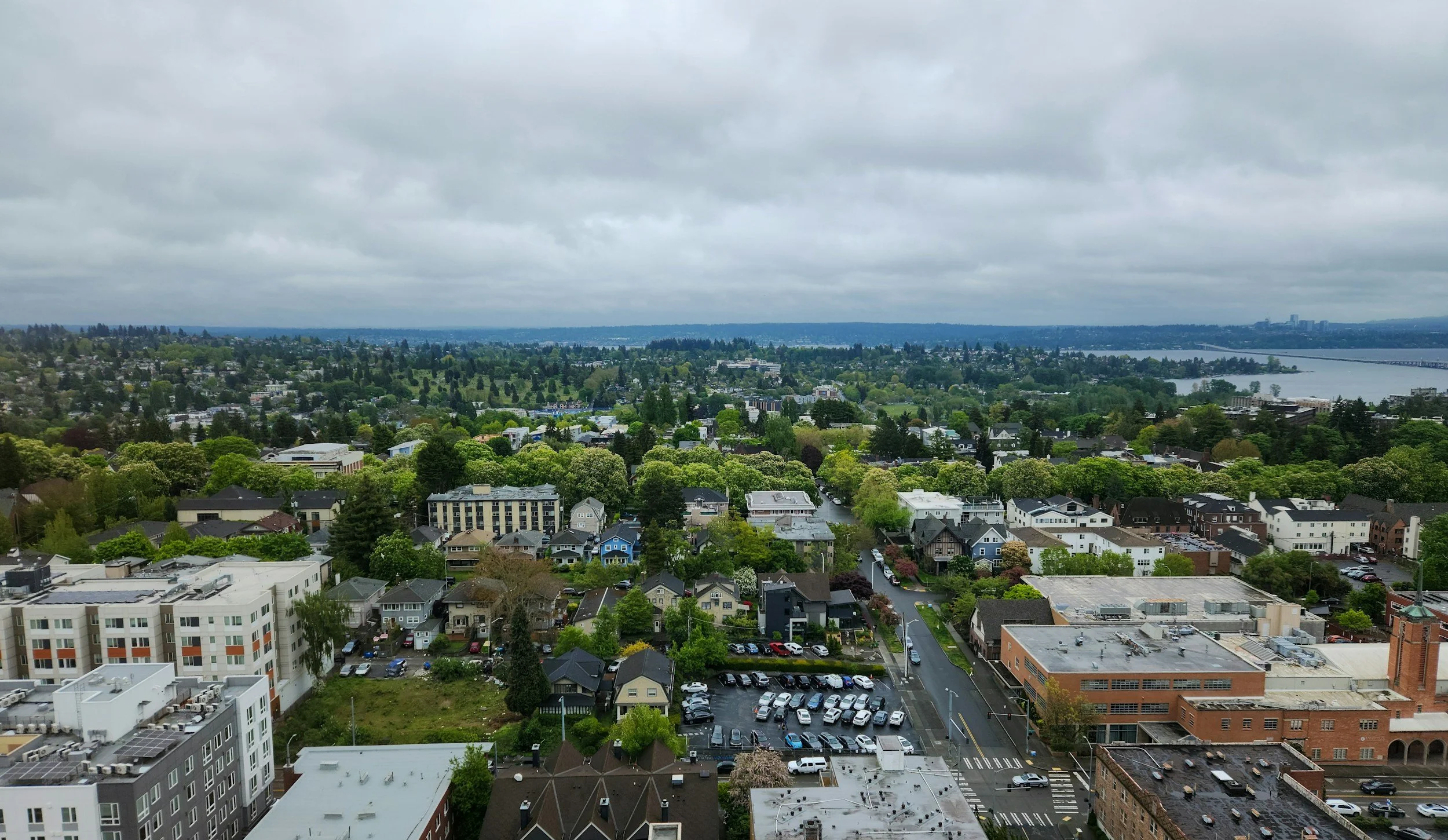 Seattle neighborhood with craftsman homes and parked cars representing home and auto insurance bundling in Washington