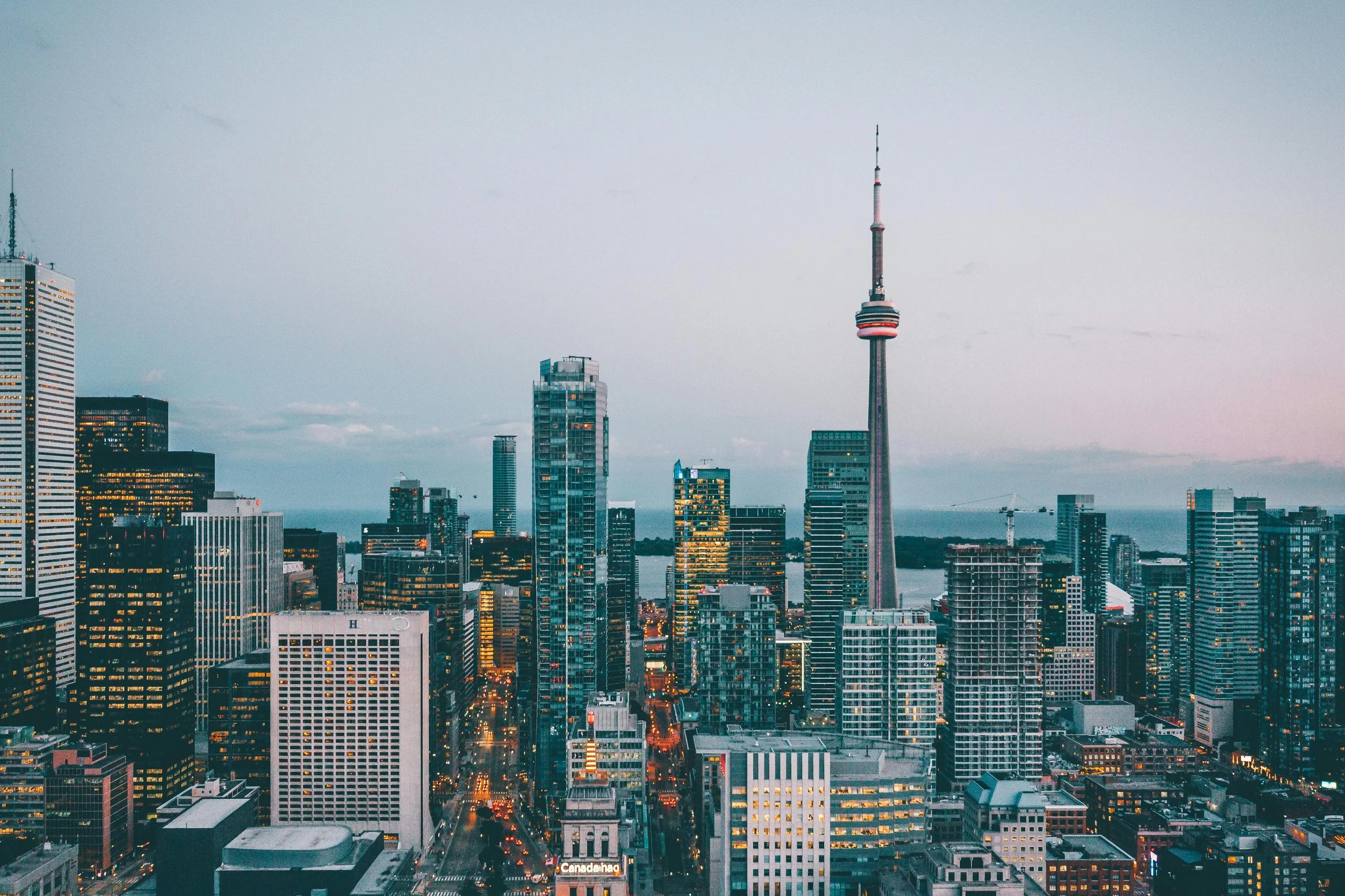 Aerial view of the Toronto skyline at dusk featuring the CN Tower — Elevated Accounting serves Canadian founders scaling toward seven figures