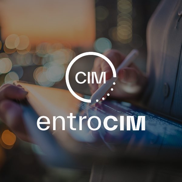 A person using a stylus and tablet at sunset with city lights in the background, with overlayed white text reading 'CIM' inside a circle and 'entrocim' beneath.