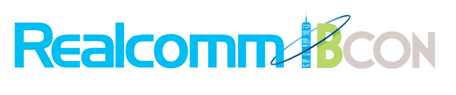 Realtor and commercial real estate conference logo with text 'Realtor' and 'Commercial' separated by a skyscraper graphic.