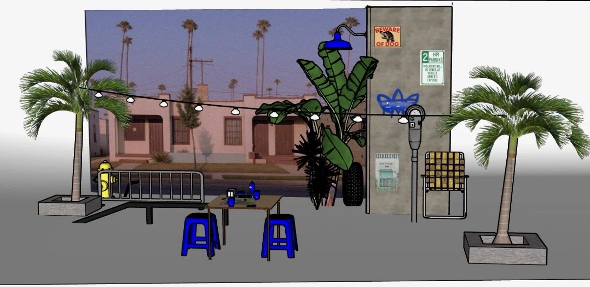 Outdoor seating area with string lights, palm trees, and urban decor in front of a building, with a table and chairs, graffiti, and various signs.