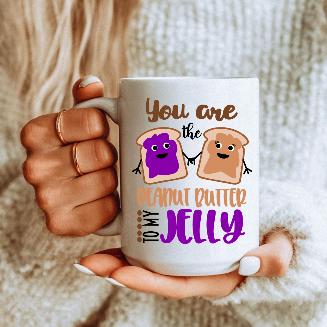 Female holding one mug from the Peanut Butter & Jelly unique coffee mug set, highlighting the design, from Coffee and Moo.