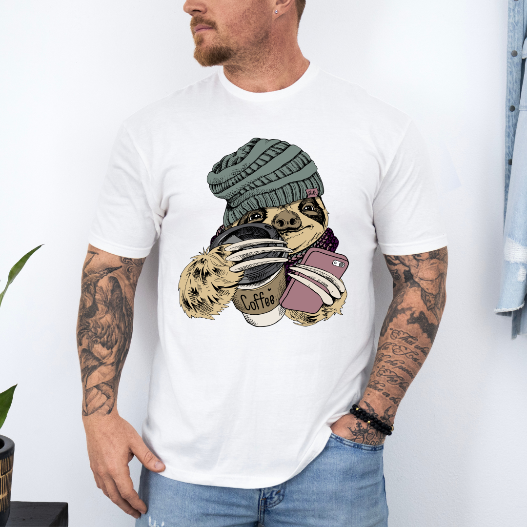 Male Model wearing a white Cozy Coffee Sloth soft graphic t-shirt, showcasing its unique design and comfortable fit from Coffee and Moo.