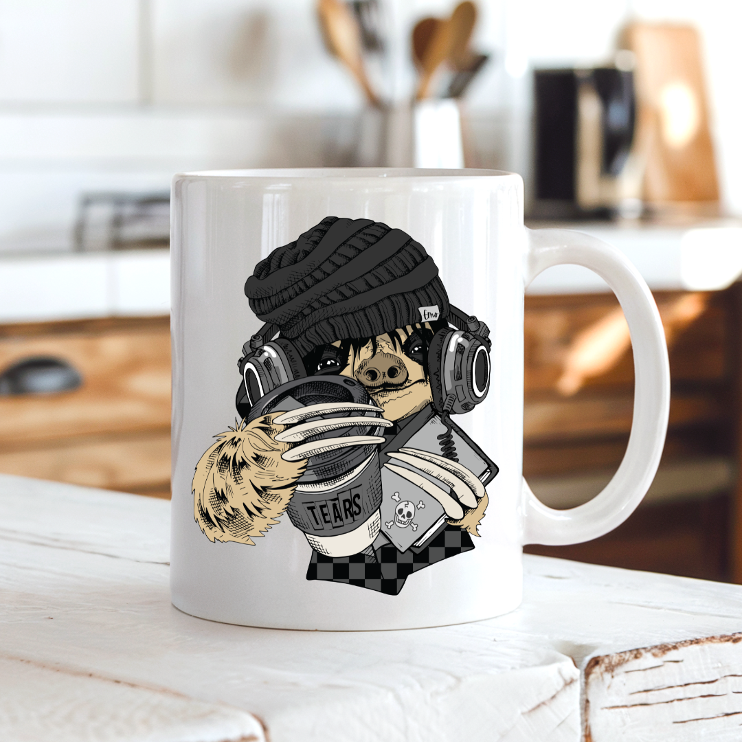 Emo Sloth Tears funny coffee mug sitting on a kitchen bench showing the detailed sloth design with headphones, from Coffee and Moo.