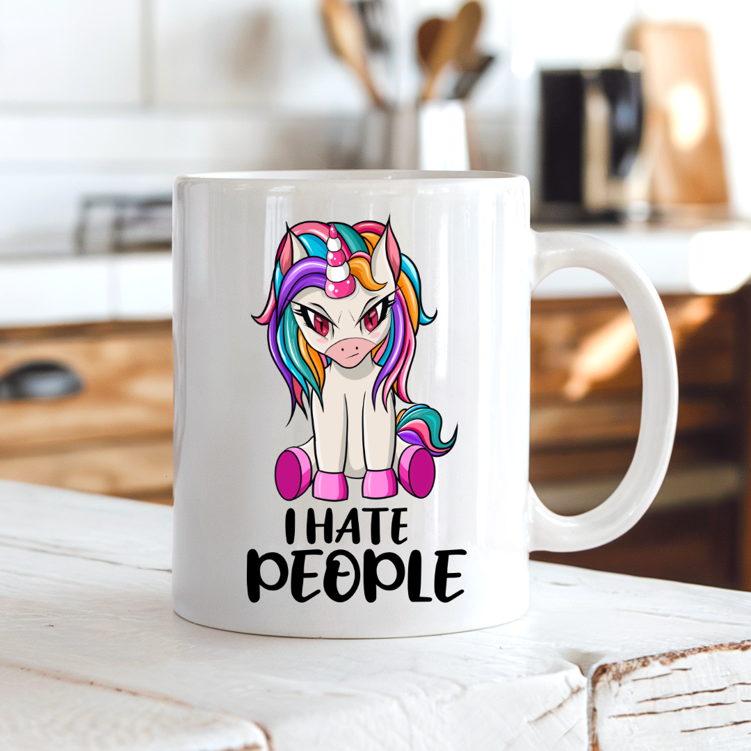 I Hate People Unicorn funny coffee mug on a country kitchen bench, adding humour to a rustic setting, by Coffee and Moo.