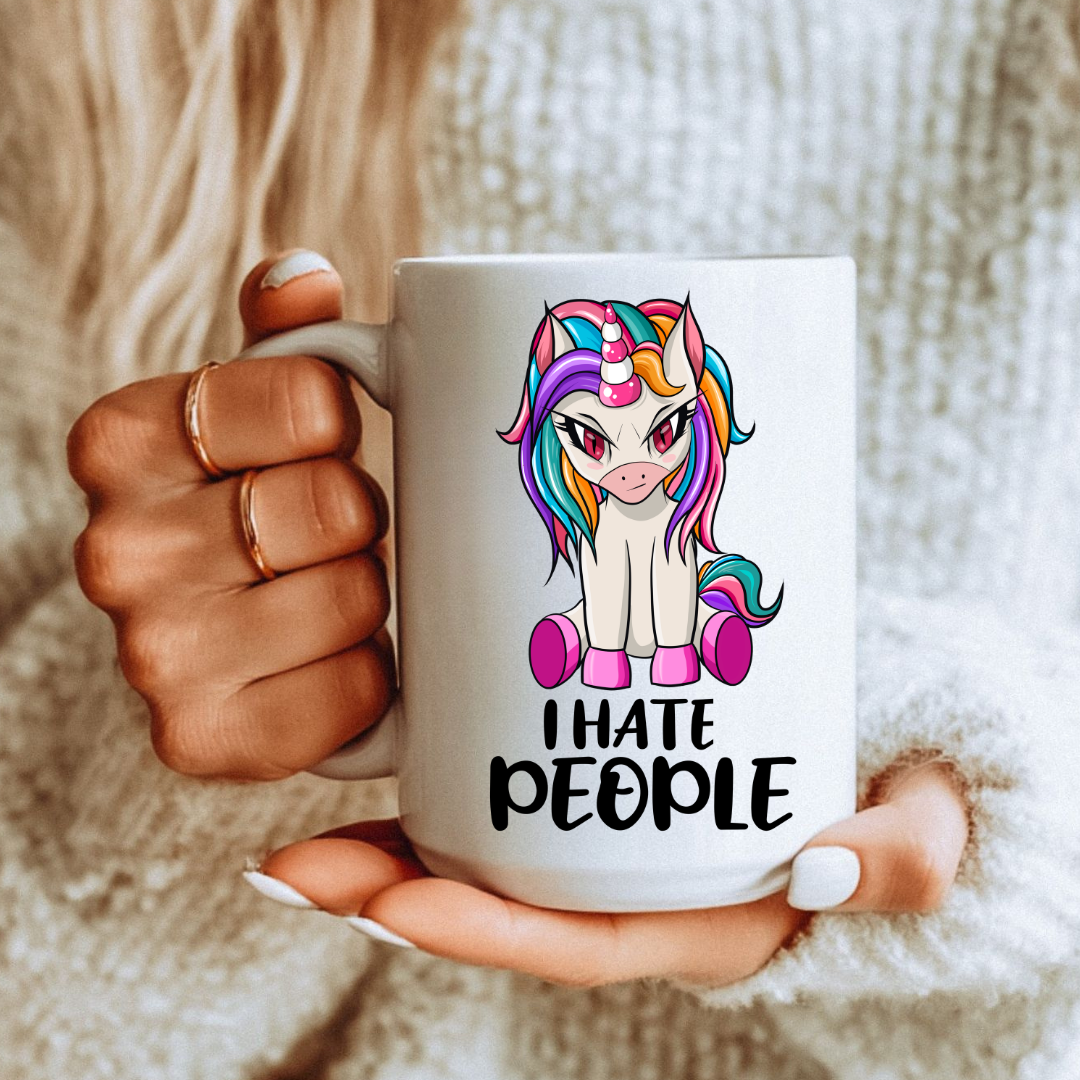 Female holding I Hate People Unicorn unique coffee mug, highlighting the "I hate people" design, from Coffee and Moo.