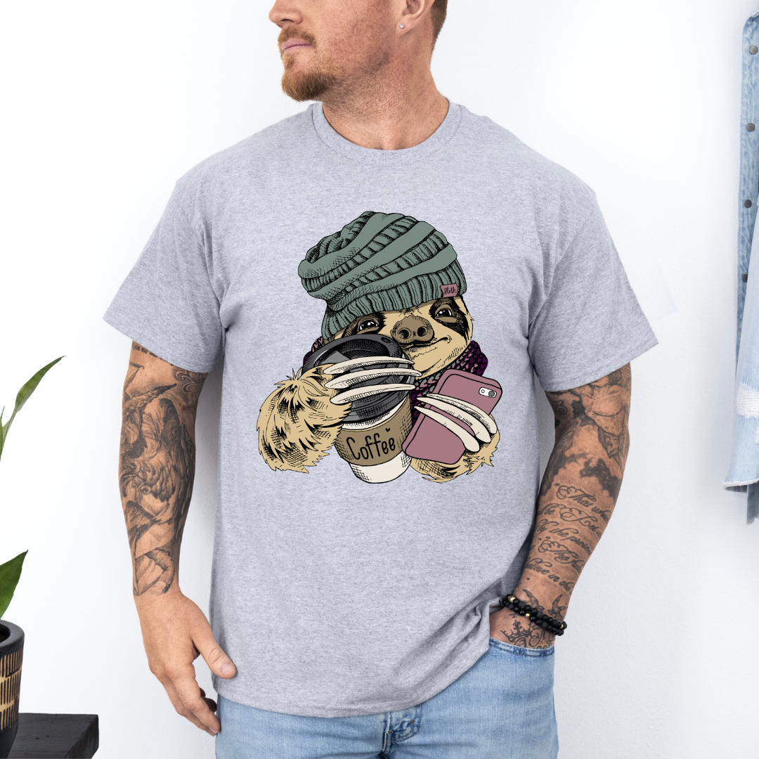 Male Model wearing a grey Cozy Coffee Sloth soft graphic t-shirt, showcasing its unique design and comfortable fit from Coffee and Moo.