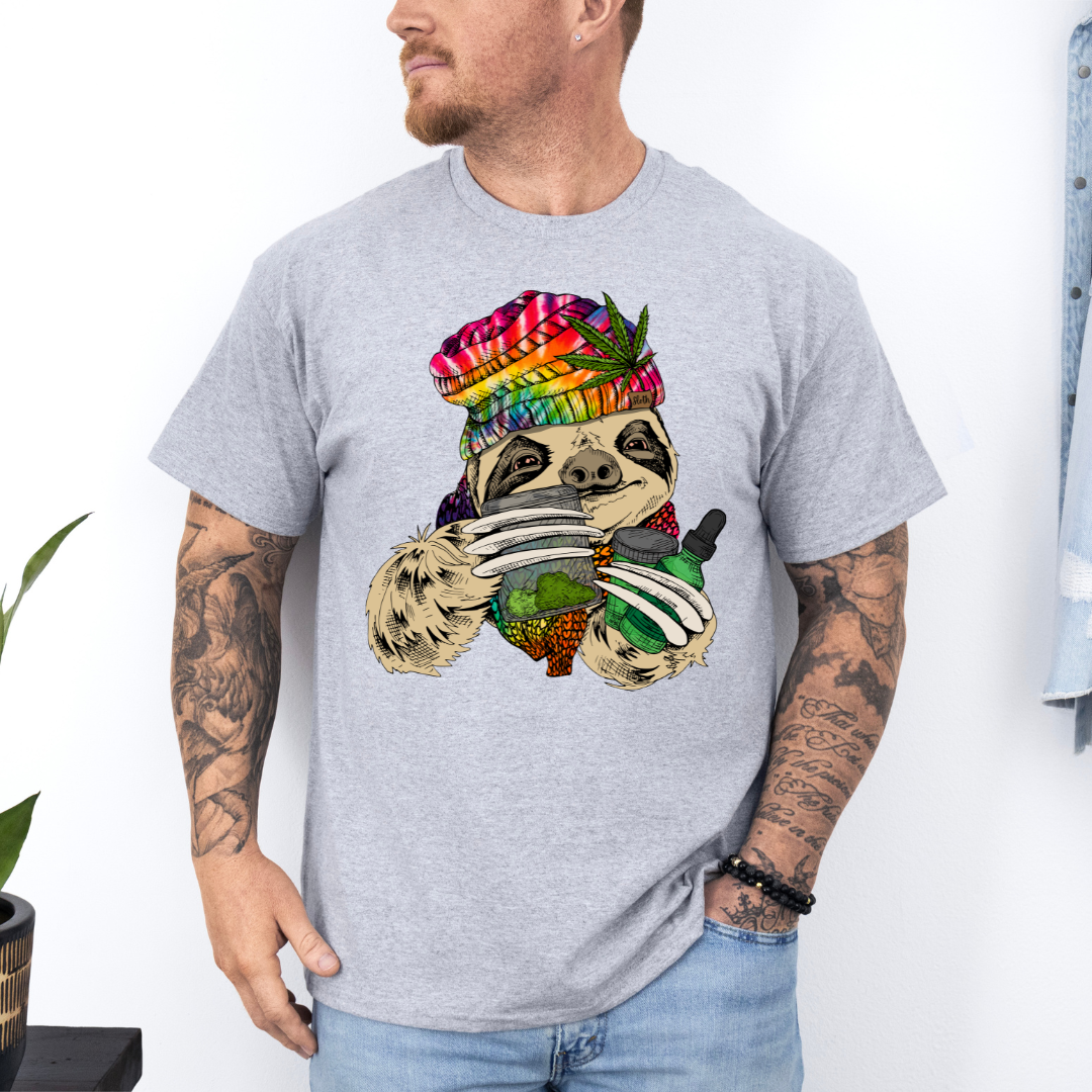 Male Model wearing a grey Chill Stoner Sloth soft graphic t-shirt, showcasing its unique design and comfortable fit from Coffee and Moo.