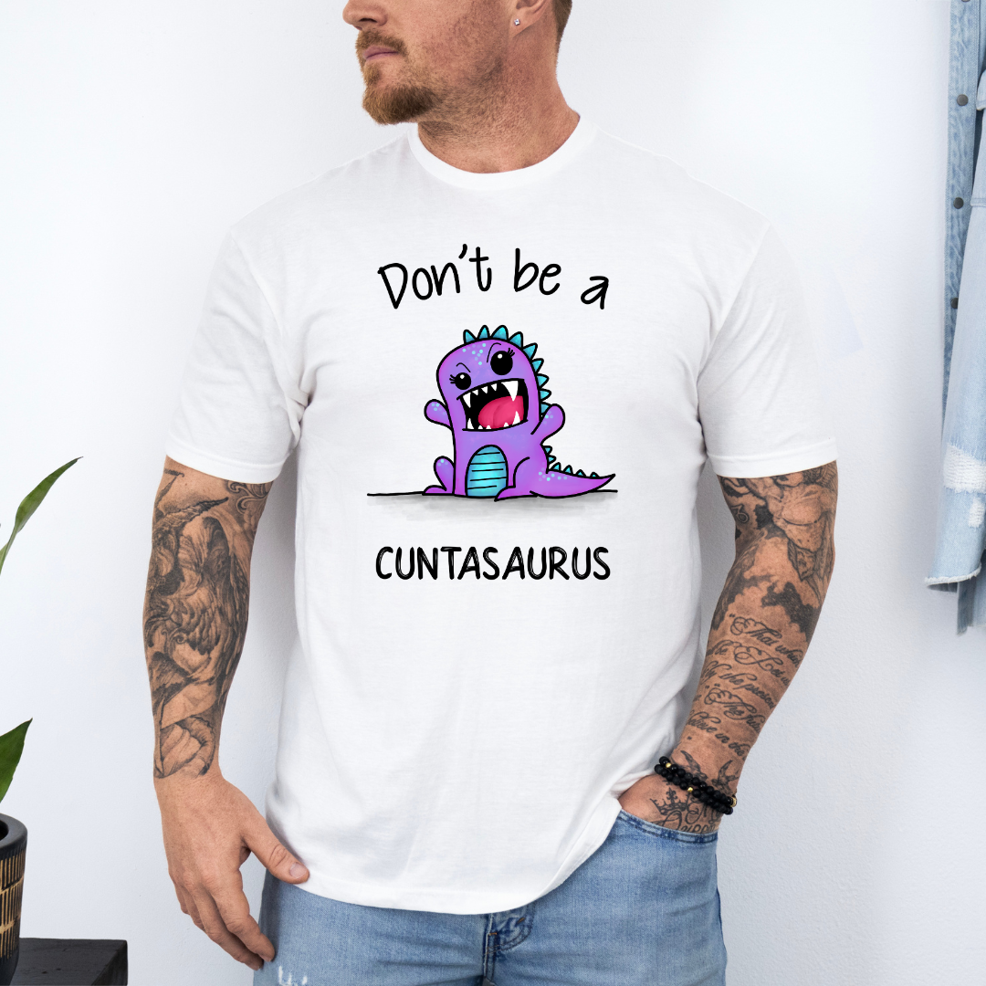 Male Model wearing a white Don’t Be a Cuntasaurus Funny Dinosaur soft graphic t-shirt, showcasing its unique design and comfortable fit from Coffee and Moo.