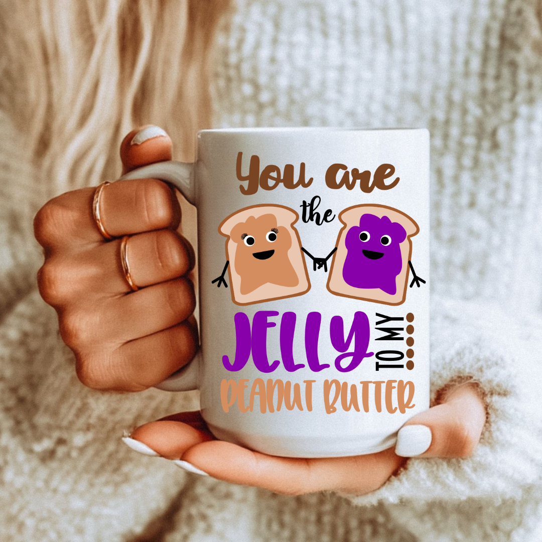 Female holding one 15oz mug from the Peanut Butter & Jelly unique coffee mug set, highlighting the design, from Coffee and Moo.