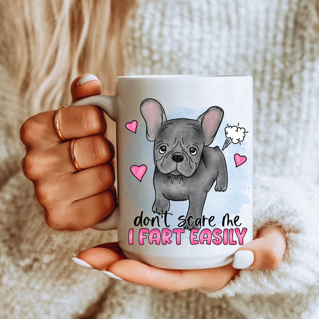 Don’t Scare Me I Fart Easily French Bulldog funny coffee mug on a country kitchen bench, adding humour to a rustic setting, by Coffee and Moo.