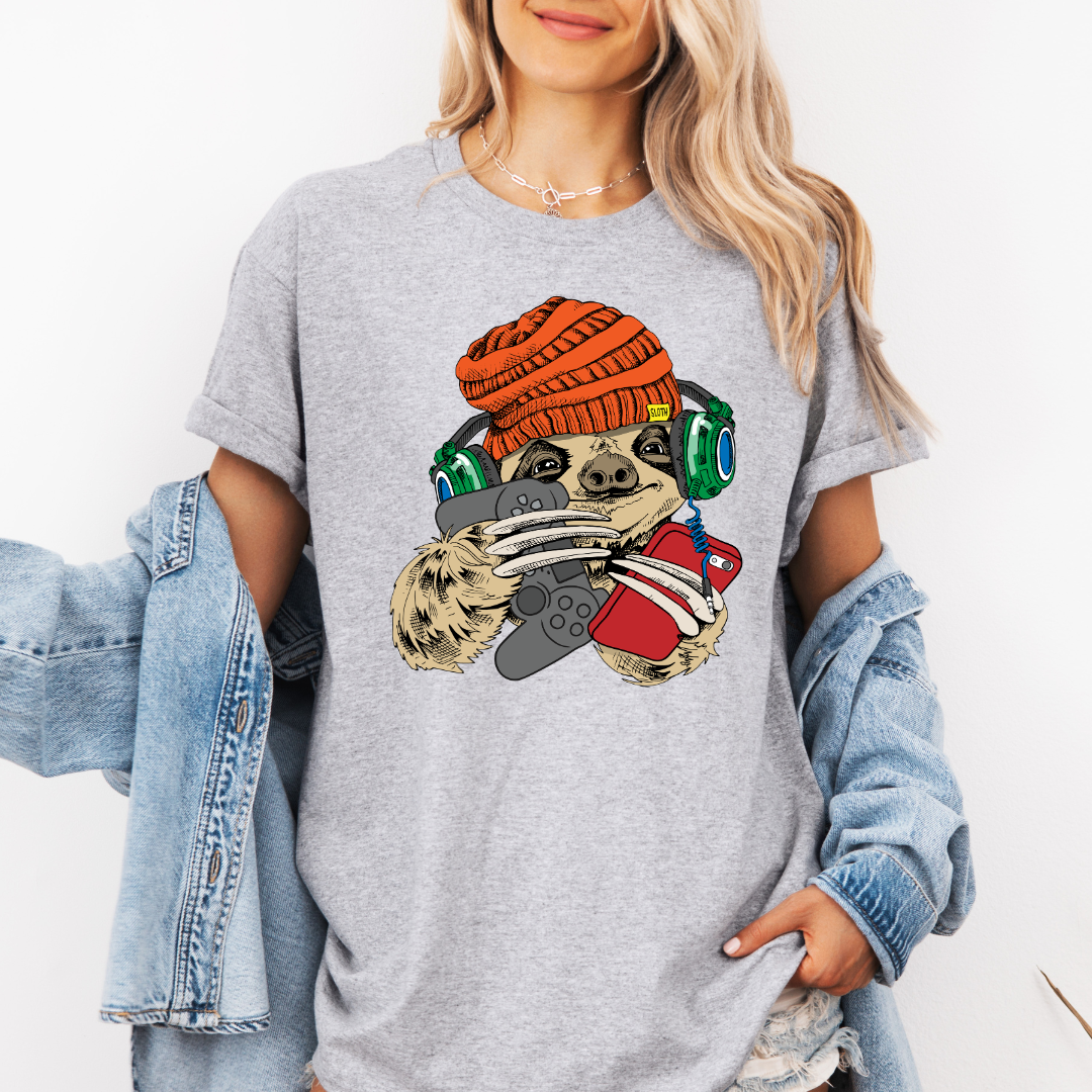 Female Model wearing a grey Gamer Sloth soft graphic t-shirt, showcasing its unique design and comfortable fit from Coffee and Moo.