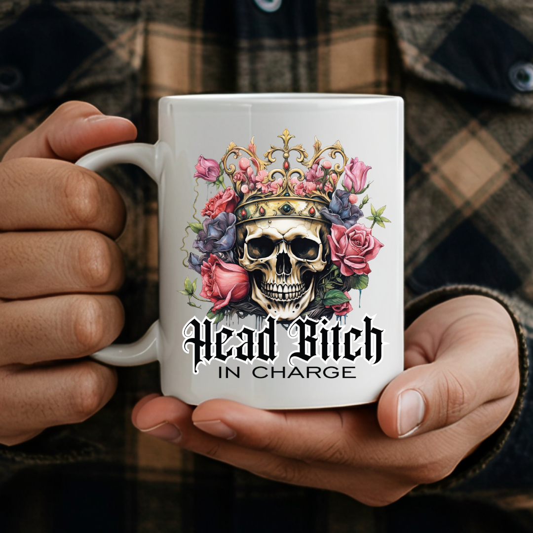 Adult holding Head Bitch In Charge humorous coffee mug, showing it as a cheeky gift for a partner, by Coffee and Moo.