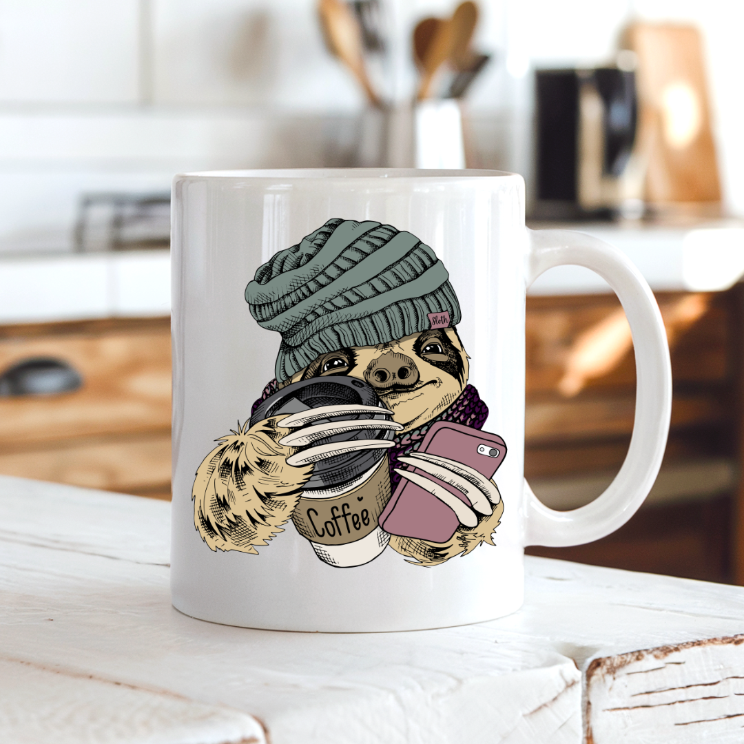 Cozy Coffee Sloth funny mug on a rustic country kitchen bench, perfect for slow mornings, by Coffee and Moo.