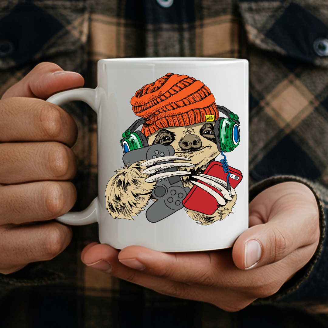 Male holding Gamer Sloth humorous coffee mug, showcasing the design and comfortable grip, by Coffee and Moo.