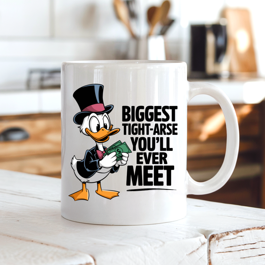 Biggest Tight-Arse Funny Duck coffee mug on a country kitchen bench, adding humour to a rustic setting, by Coffee and Moo.