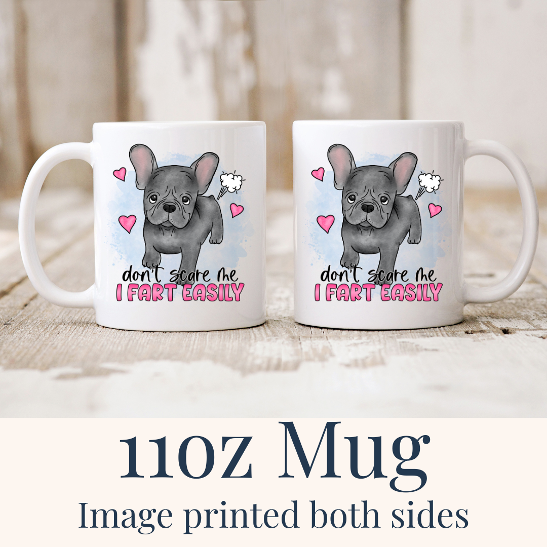 11oz Don’t Scare Me I Fart Easily French Bulldog ceramic mugs, with the "Don’t scare me I fart easily" design visible on both sides, from Coffee and Moo.